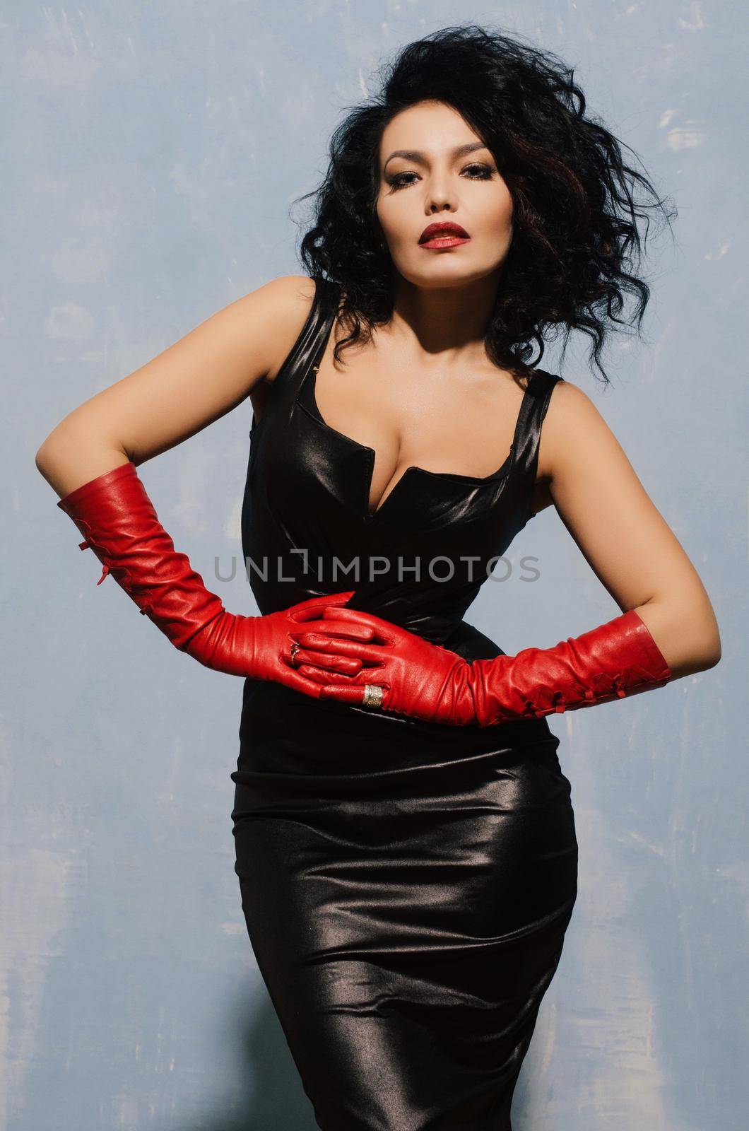 Beautiful adult woman wearing black spandex dress and long red leather gloves by zartarn