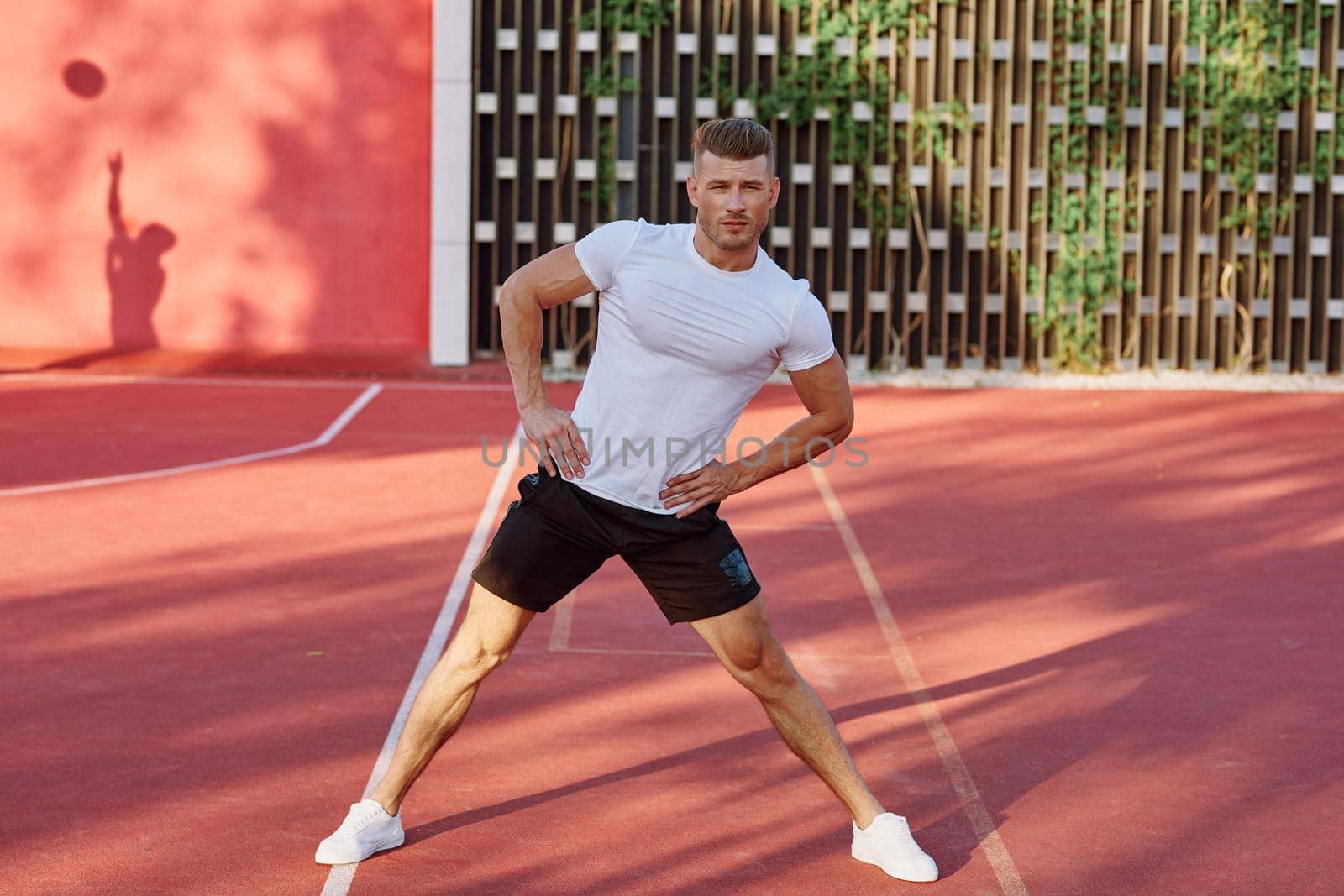 man on the sports ground exercise warm-up lifestyle. High quality photo