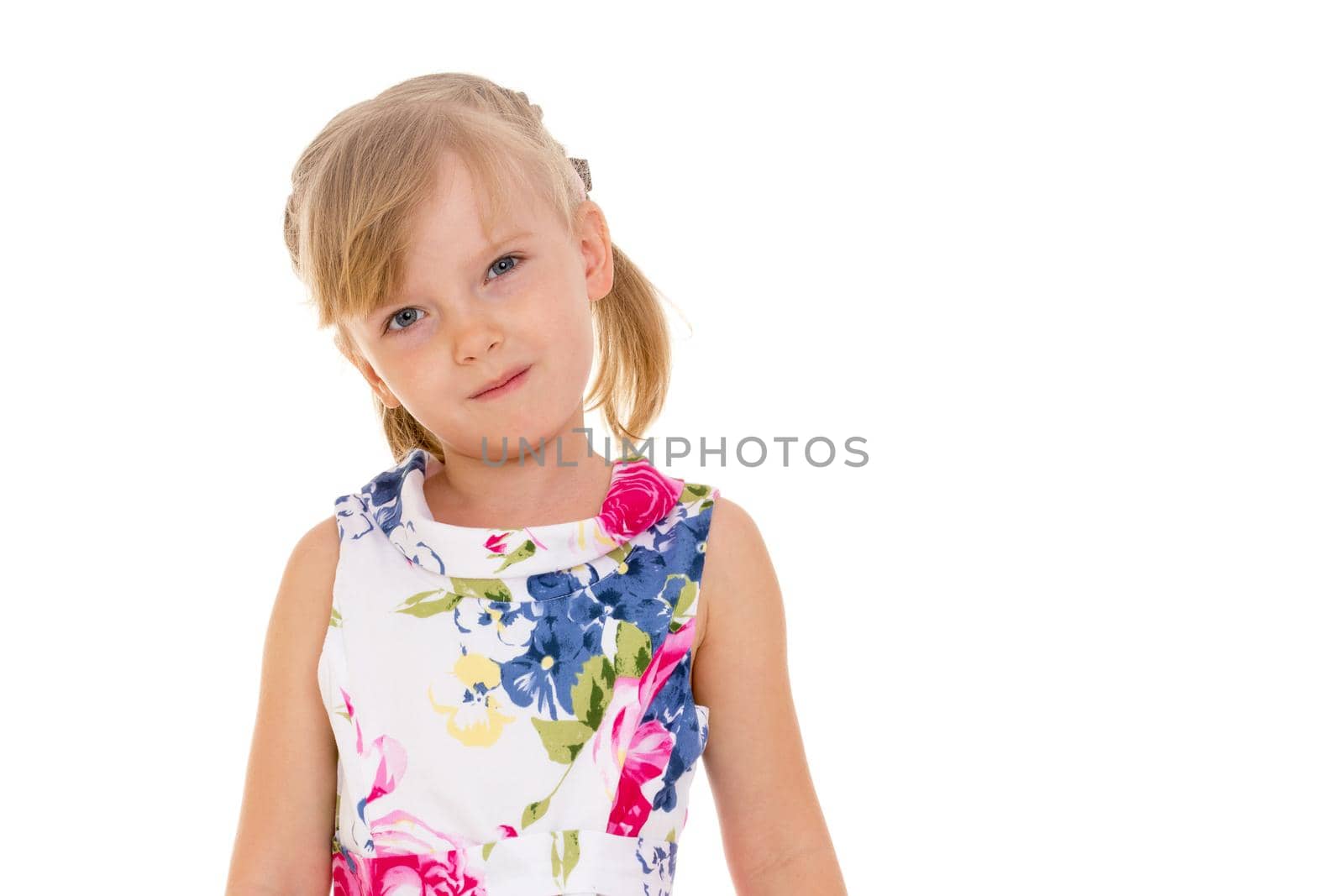 Beautiful little girl posing in the studio. Children's emotions concept. Close-up. Isolated on white background.