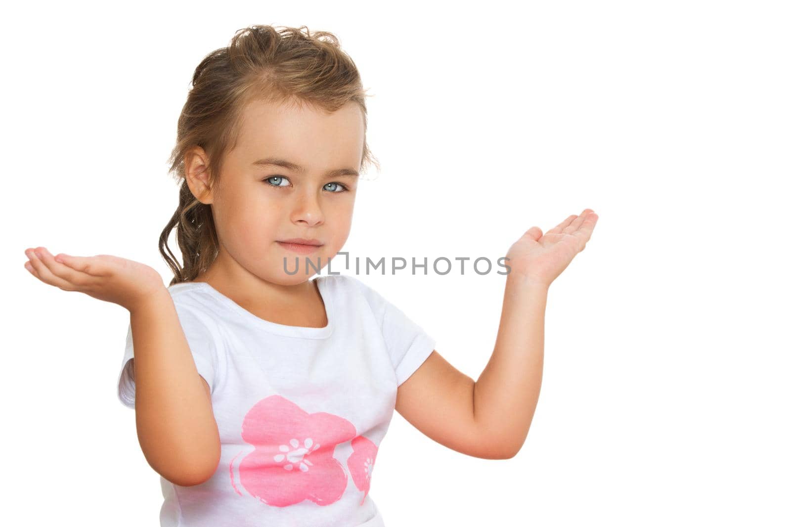 Beautiful little girl posing in the studio. Children's emotions concept. Close-up. Isolated on white background.