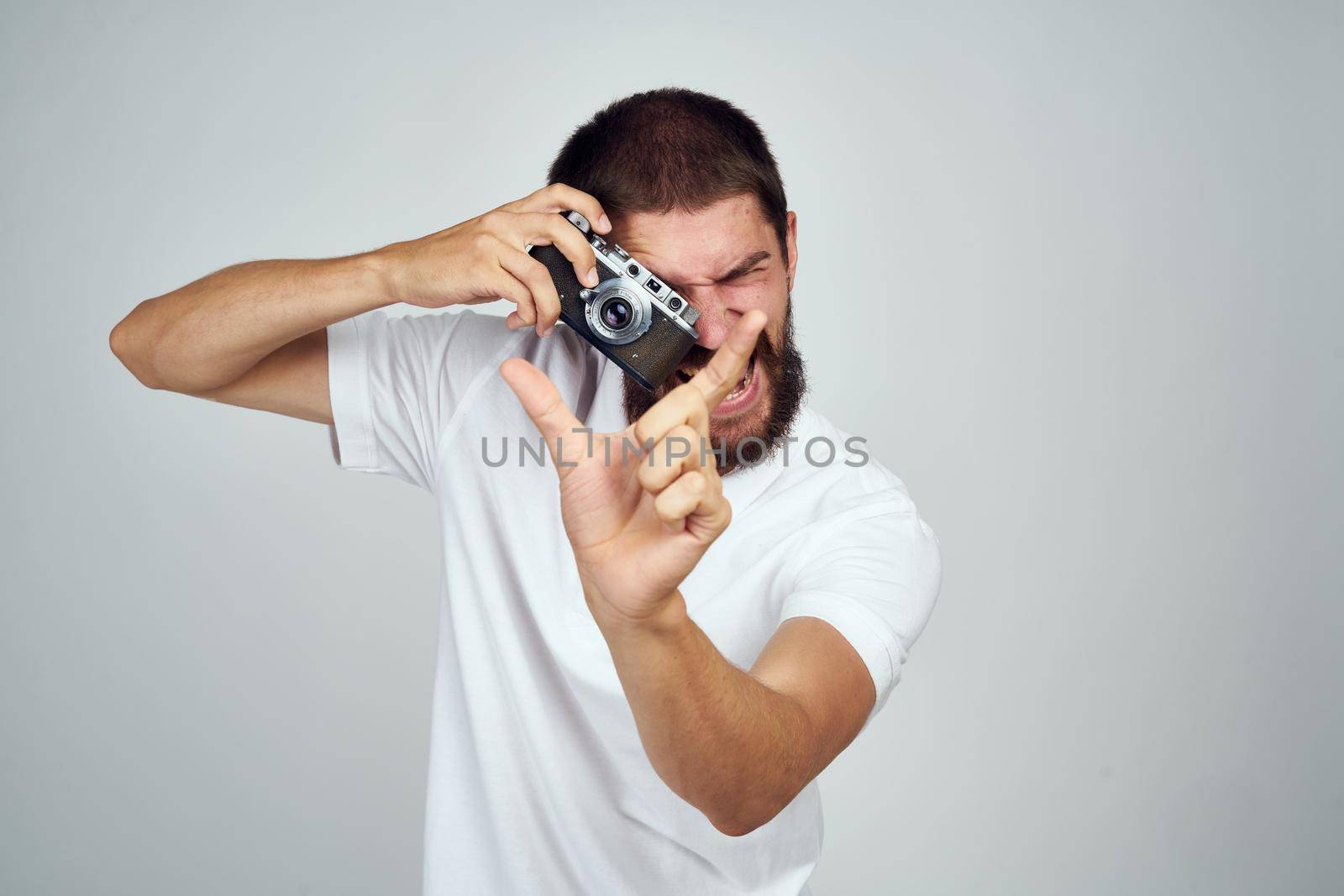 bearded man photographer camera professional hobby light background by Vichizh