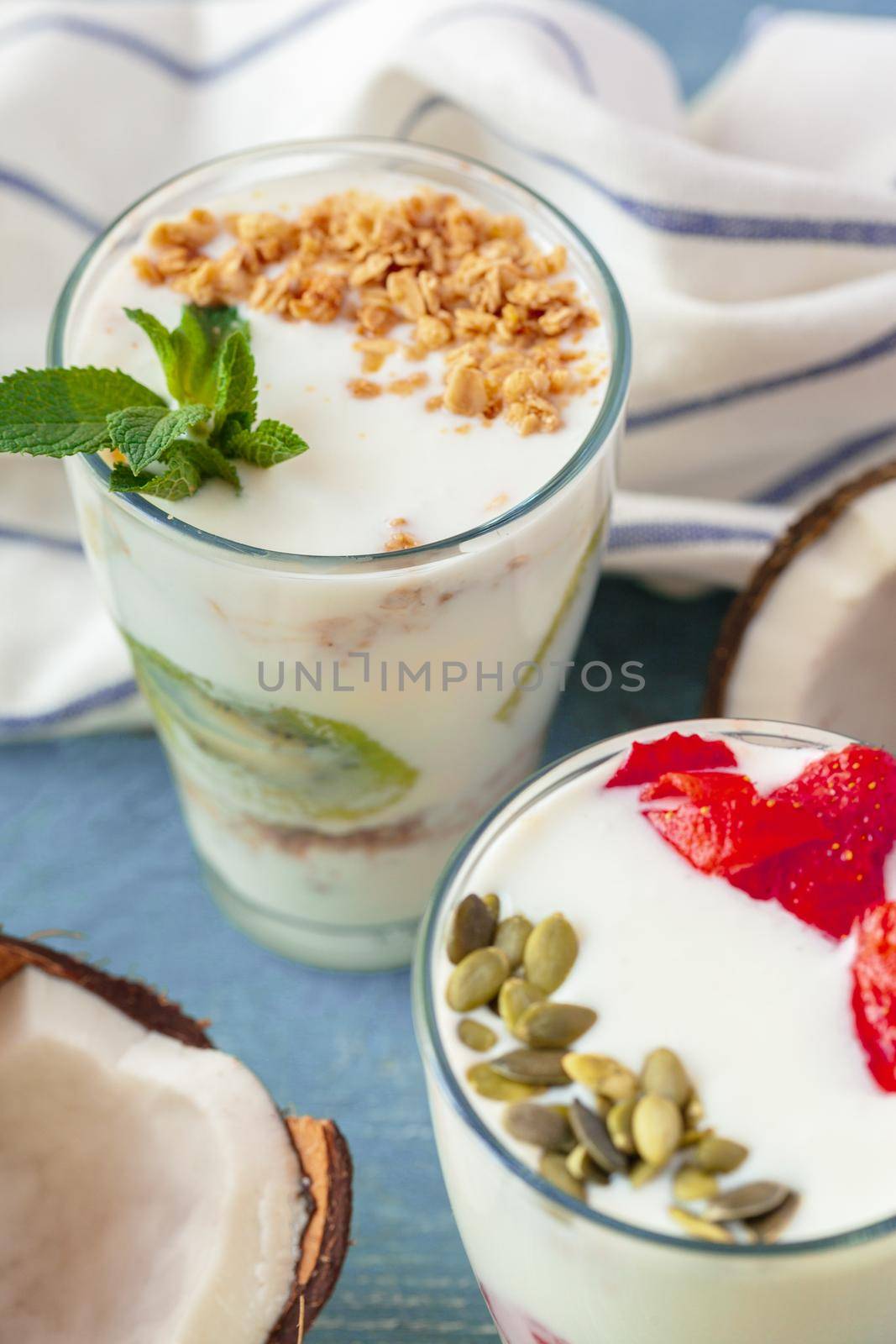 Granola with yogurt and berries for healthy breakfast on a table