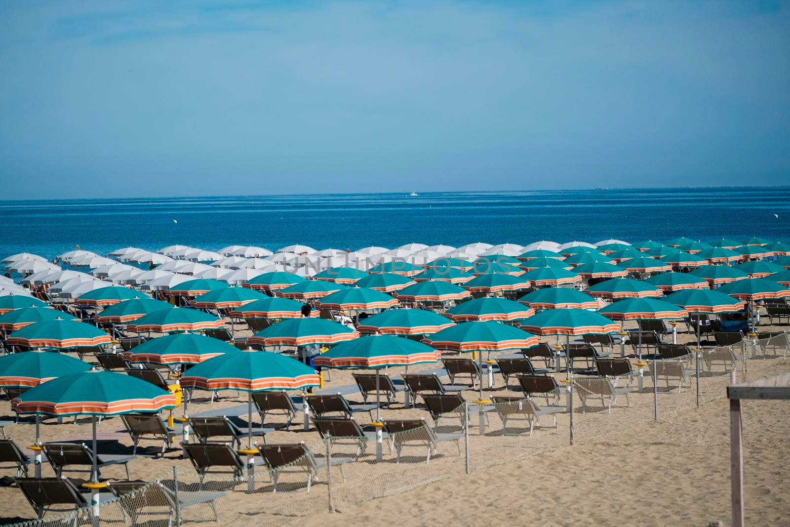 umbrellas open on the seafront of Riccione on the Romagna Riviera. High quality photo