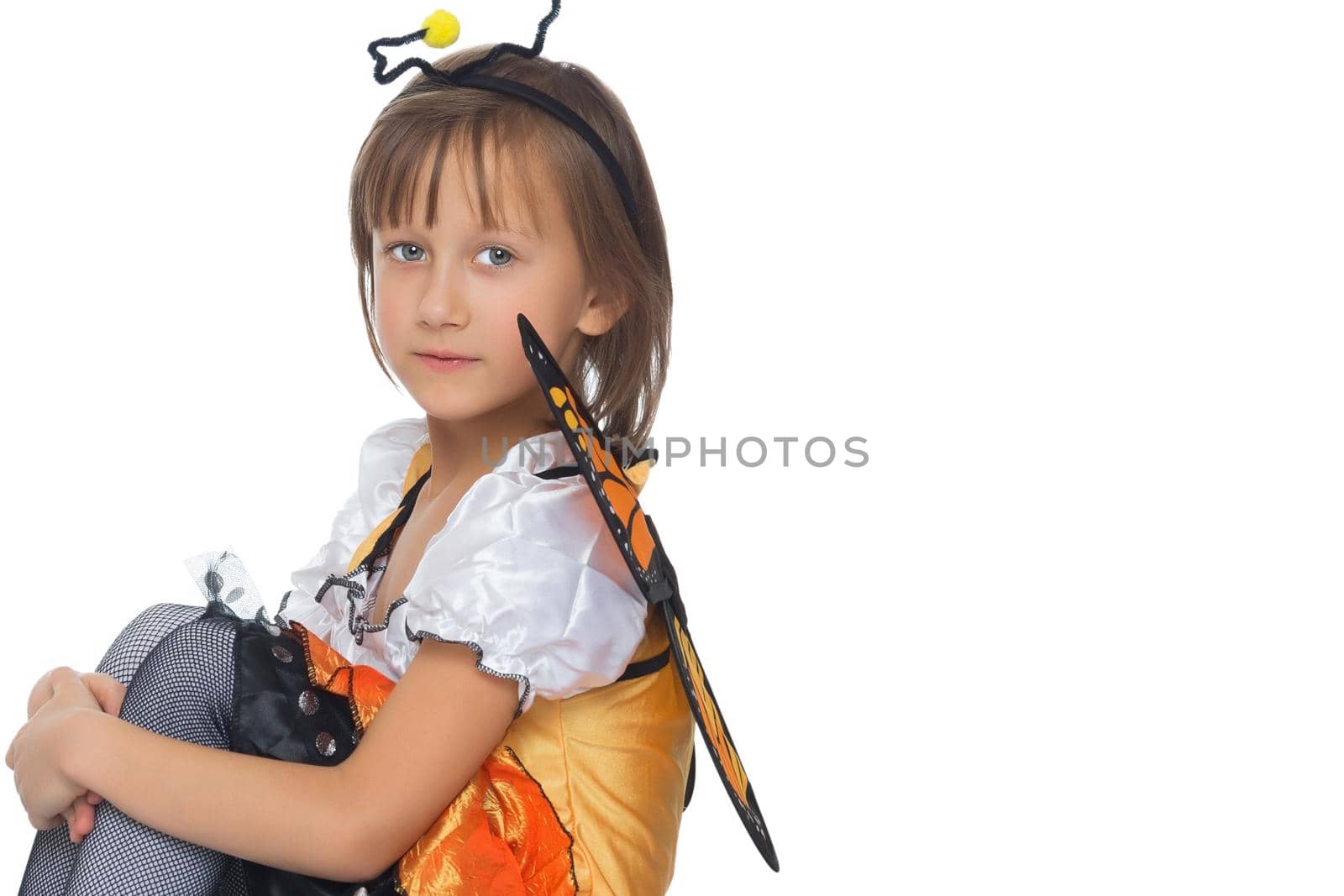 Beautiful little girl posing in the studio. Children's emotions concept. Close-up. Isolated on white background.