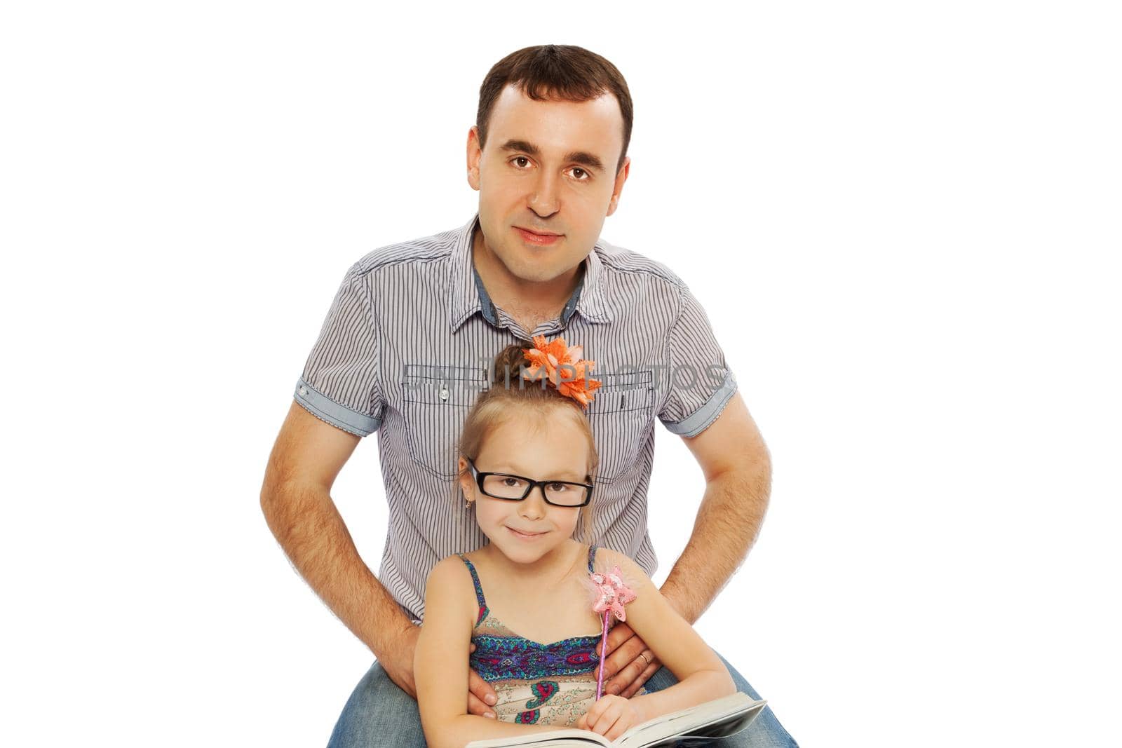 Father and daughter sitting on the floor and read a book-Isolated on white background