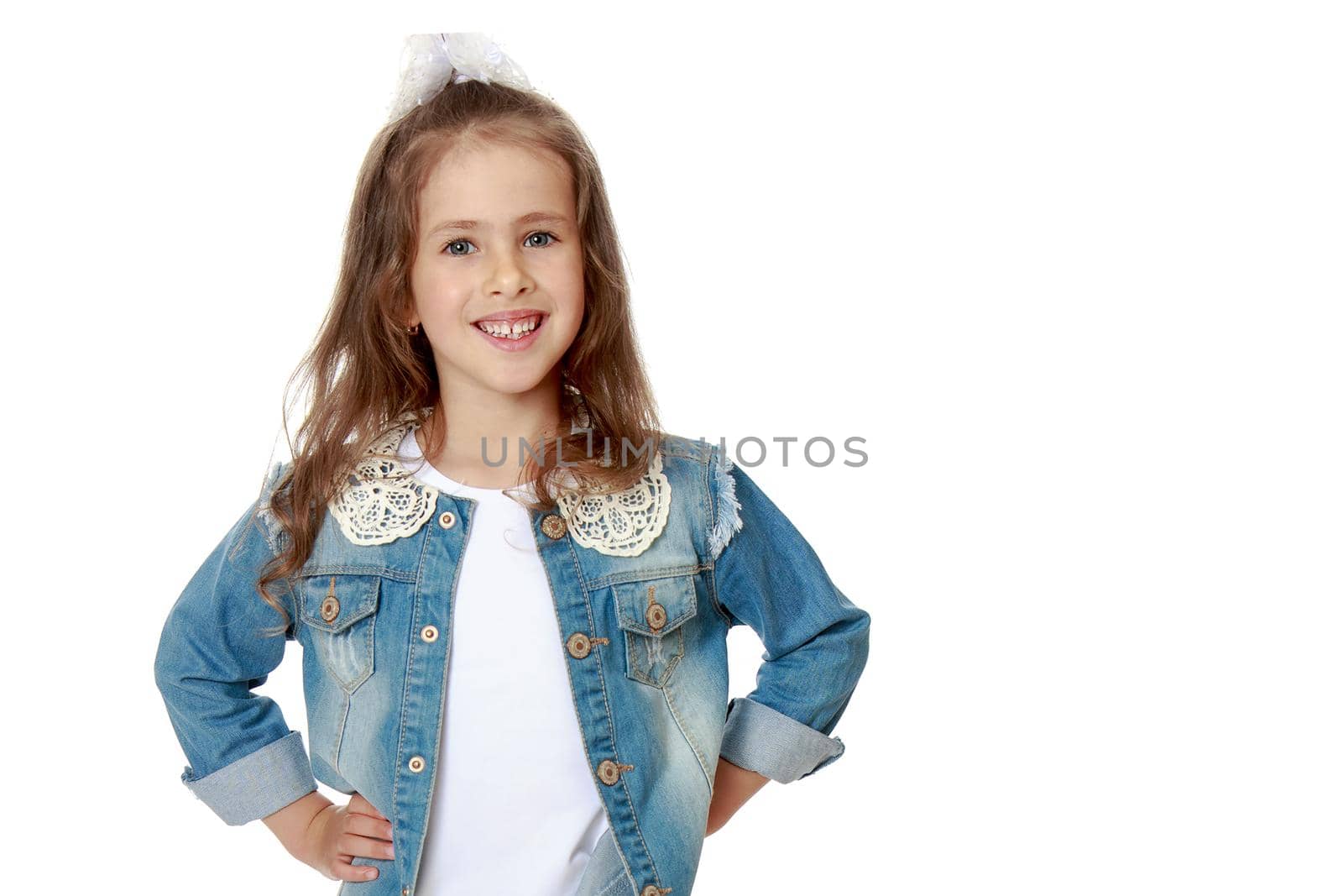 Beautiful little girl posing in the studio. Children's emotions concept. Close-up. Isolated on white background.