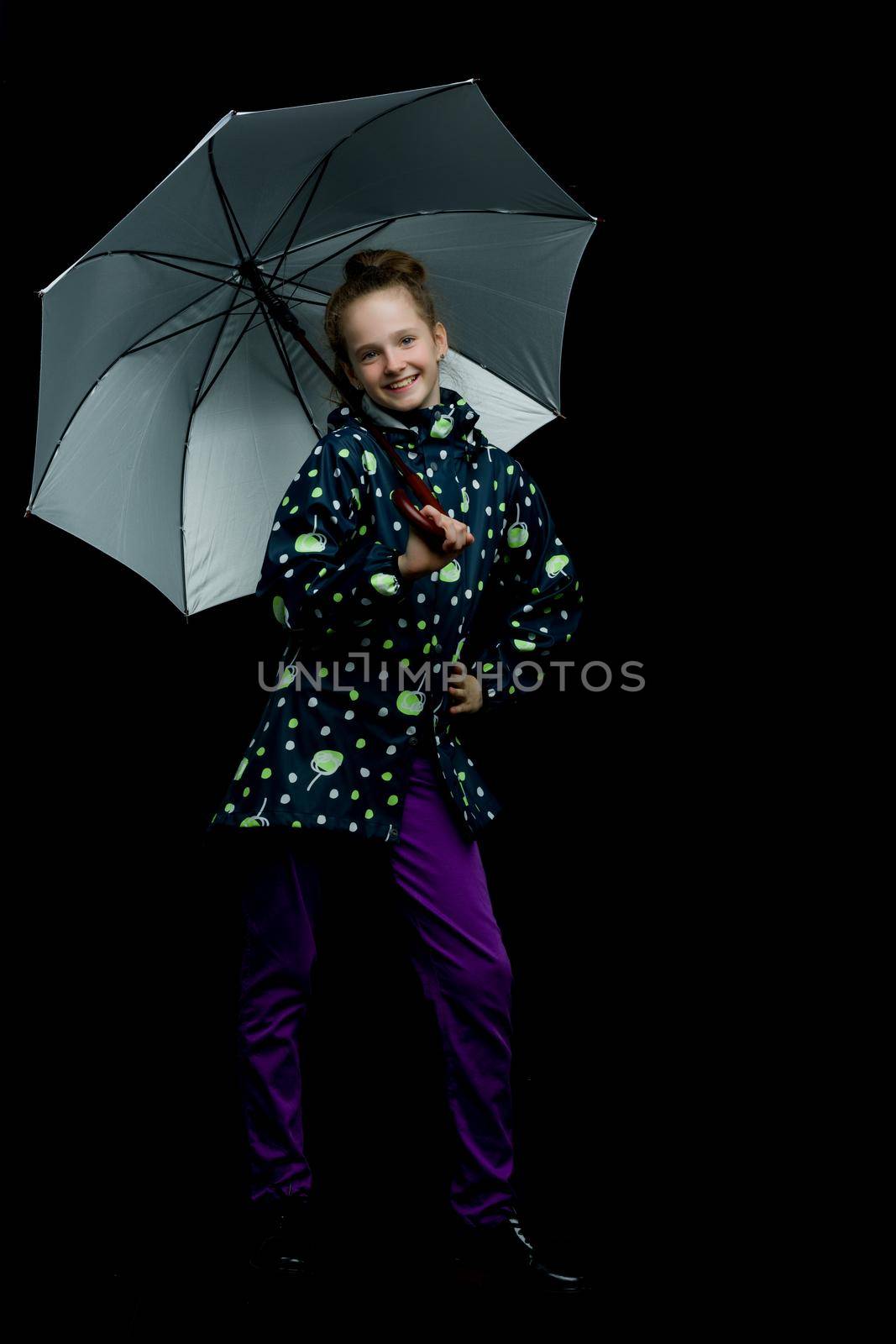 Beautiful little girl with umbrella. Concept of weather, climate change. Isolated