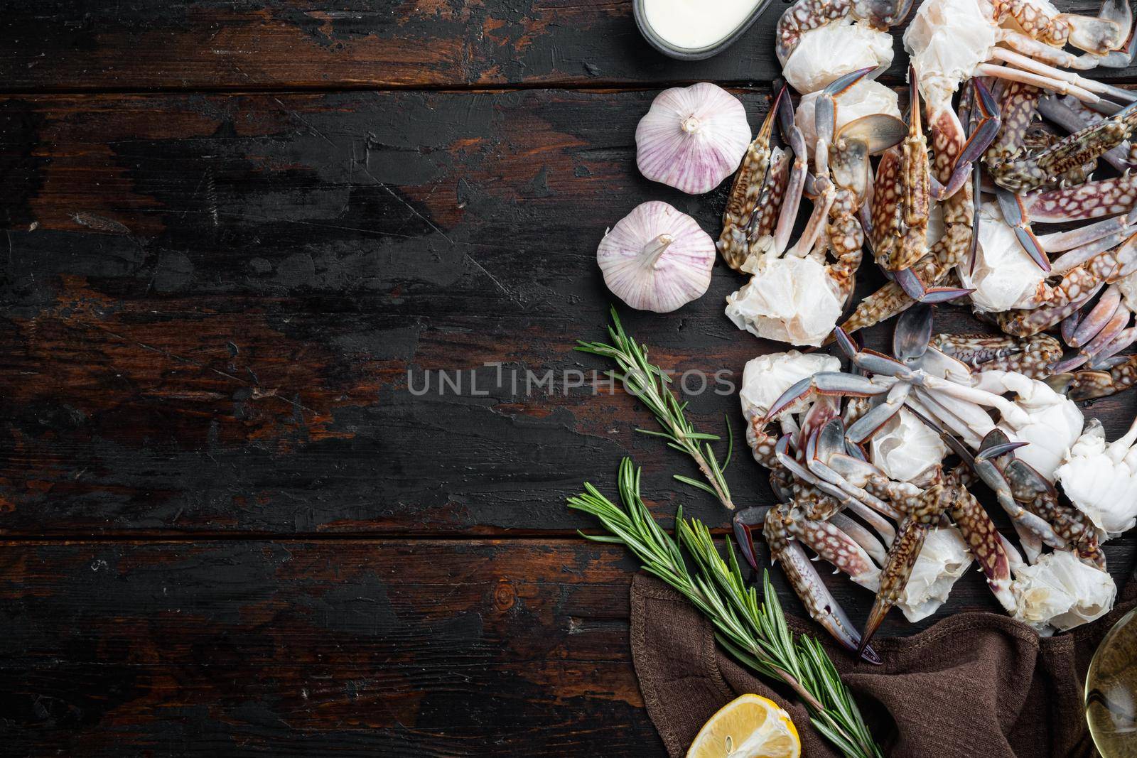 Fresh raw Horse crab, Blue crab, Flower crab set, on dark wooden background, top view flat lay , with copyspace and space for text