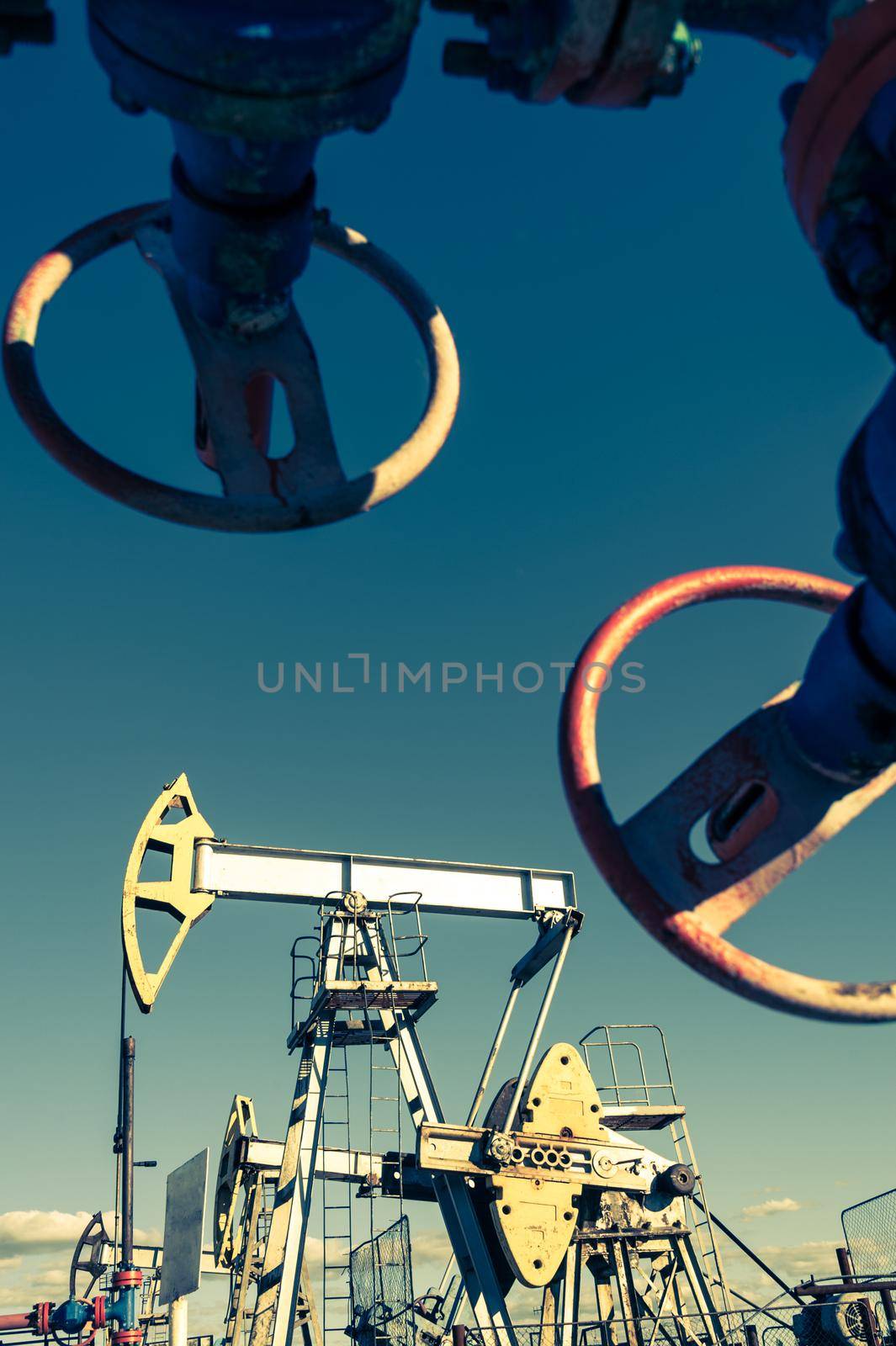 Oil pumpjack, industrial equipment. Rocking machines for power generation. Extraction of oil. by bashta