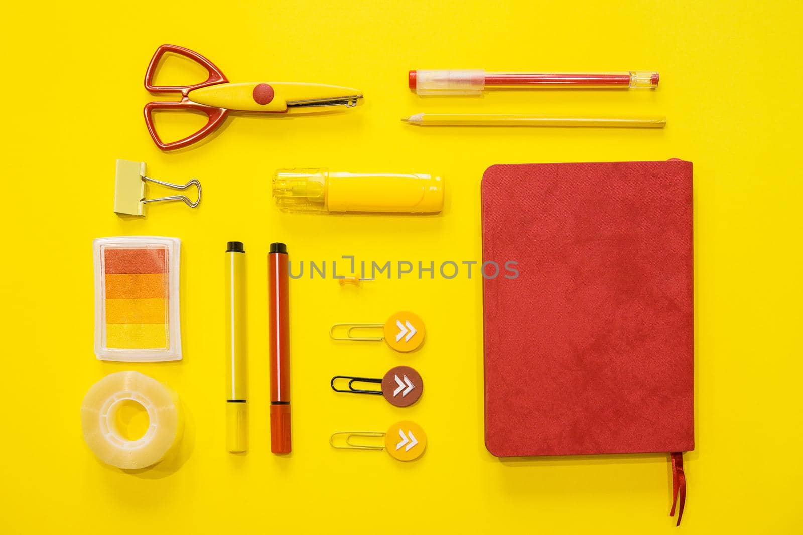 Yellow and red colors. Flat lay composition. Yellow background. Space for text. Back to school. by Annu1tochka