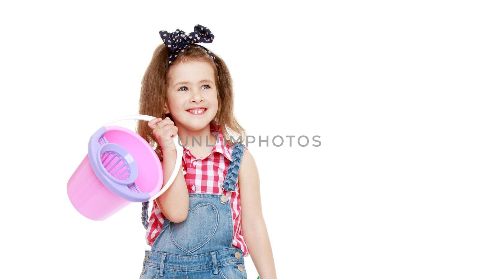 Beautiful little girl posing in the studio. Children's emotions concept. Close-up. Isolated on white background.