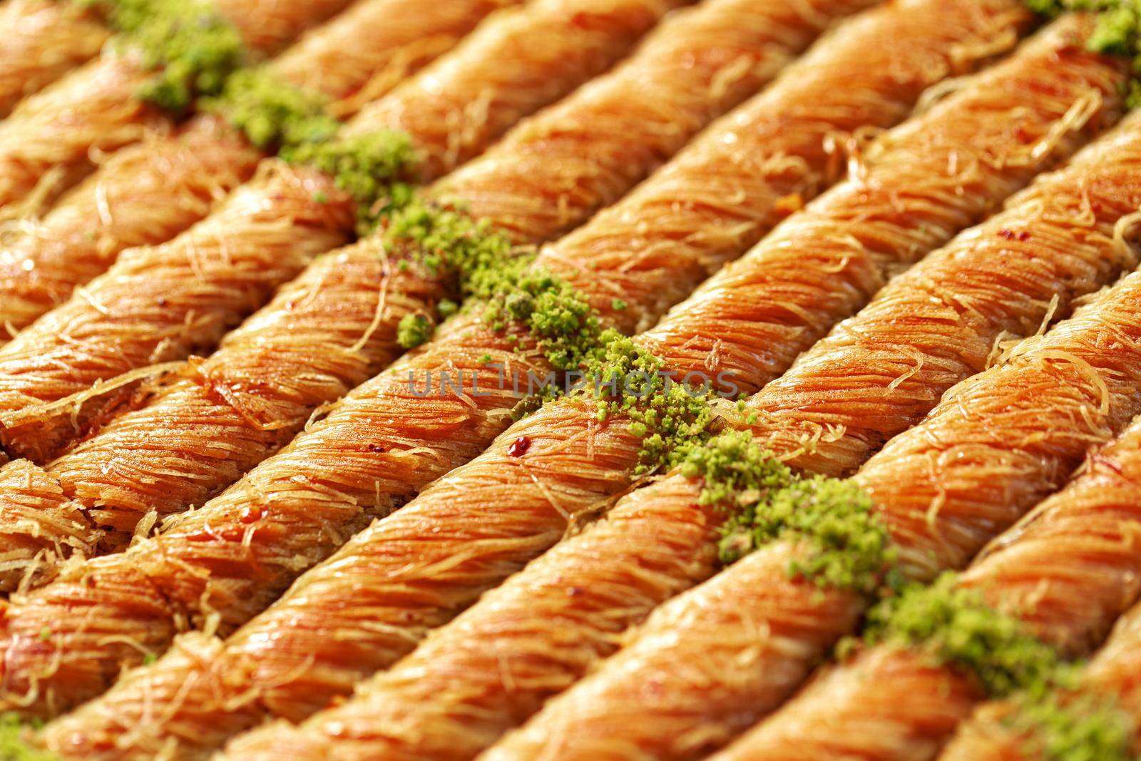 Close up photo of Turkish Baklava dessert with honey and nuts