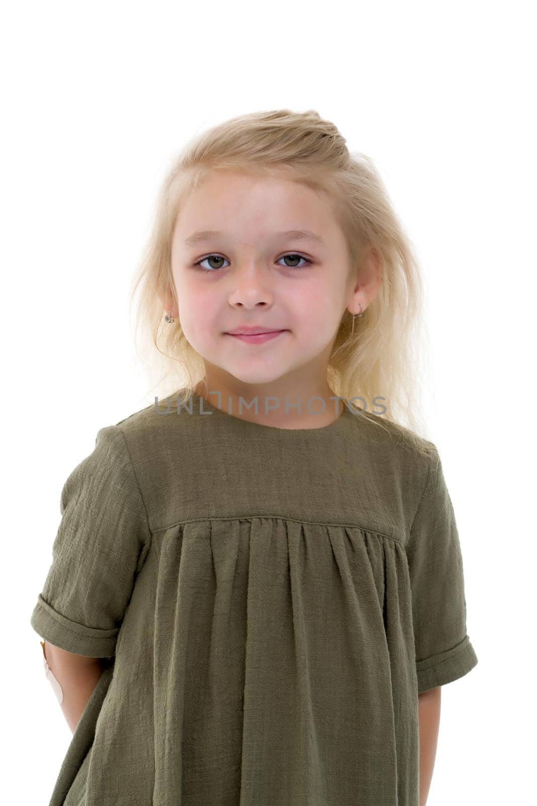 Beautiful little girl posing in the studio. Children's emotions concept. Close-up. Isolated on white background.