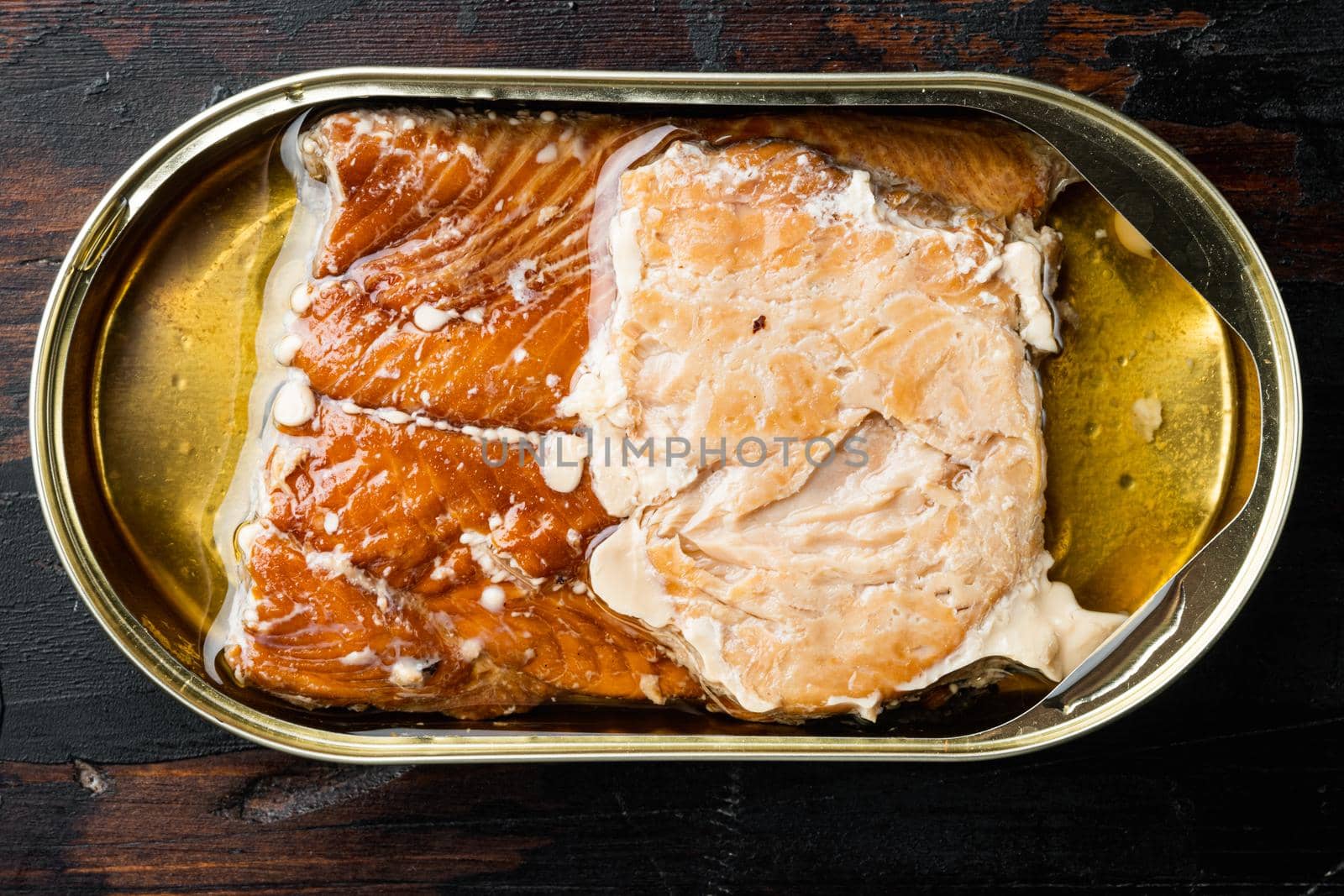 Smoked Salmon Fillets Canned fish set, in tin can, on old dark wooden table background, top view flat lay