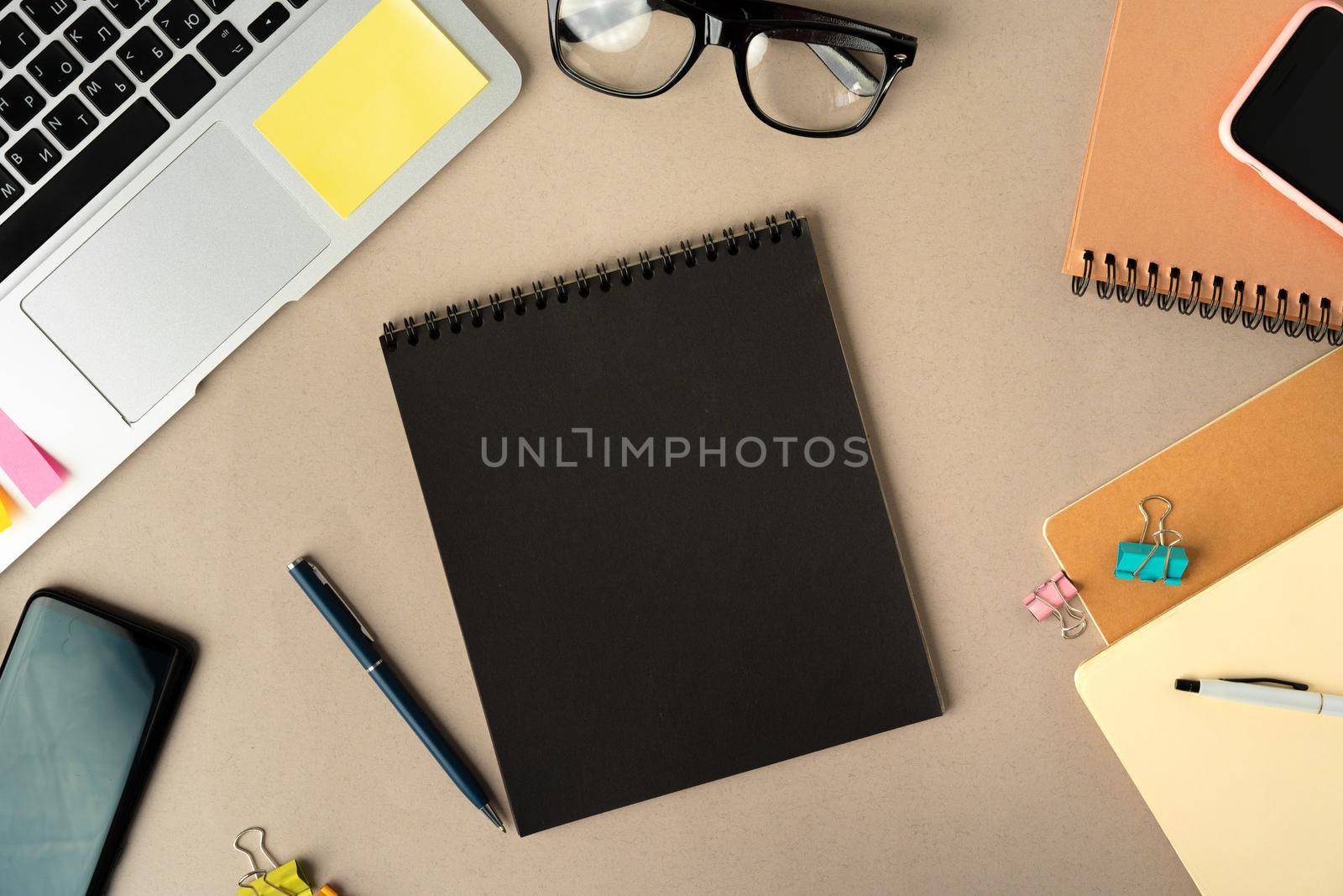 Open laptop with blank notebook, view from above. Workplace office concept