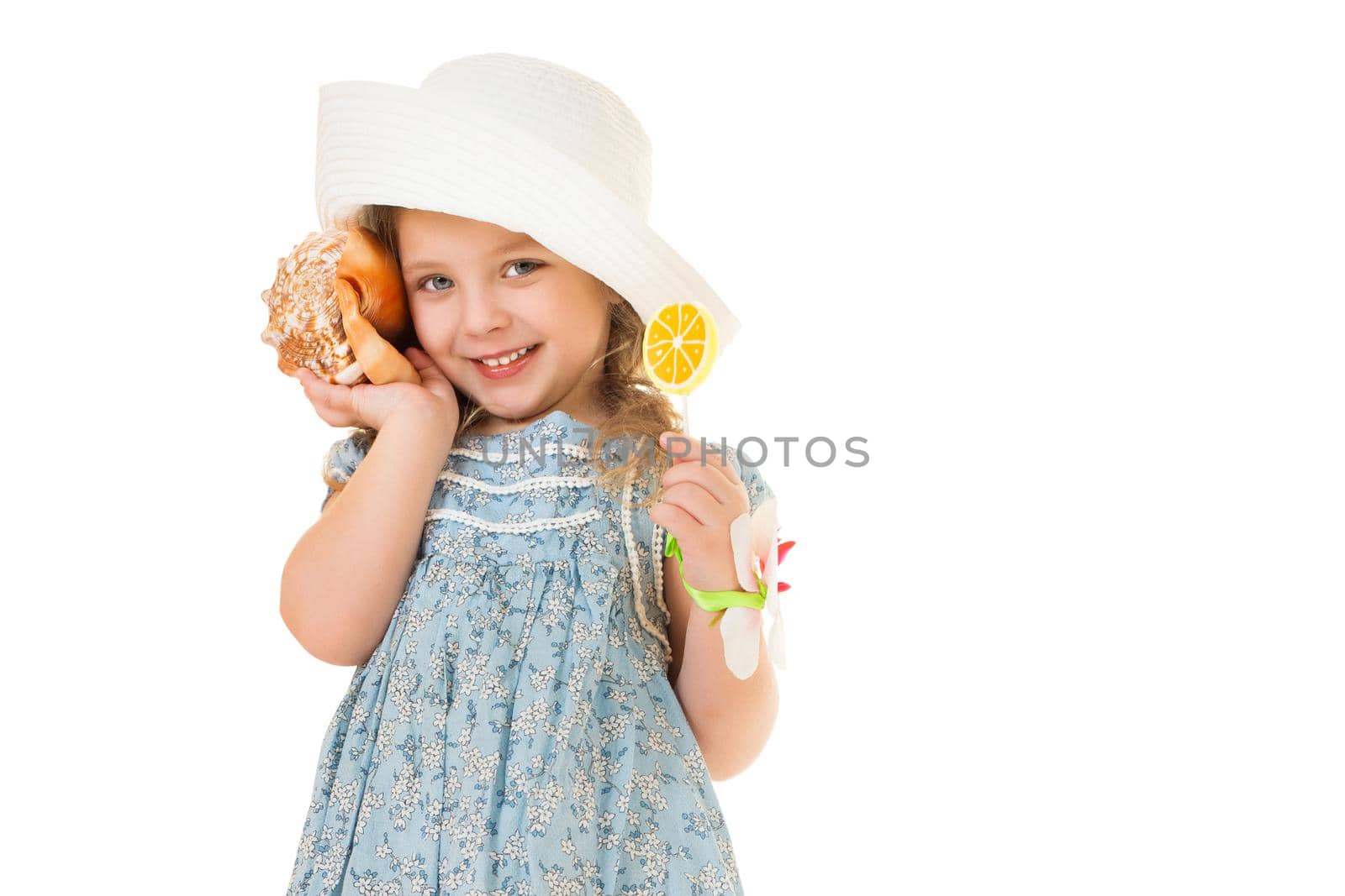 A little girl with a sea shell. The concept of a family vacation at sea, ecology. Isolated on white background.