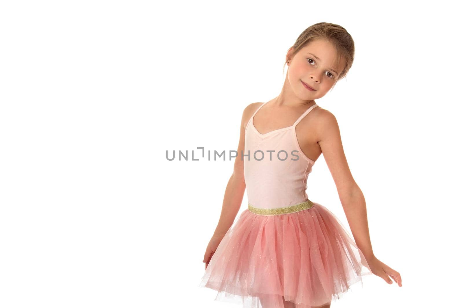 Beautiful little girl posing in the studio. Children's emotions concept. Close-up. Isolated on white background.