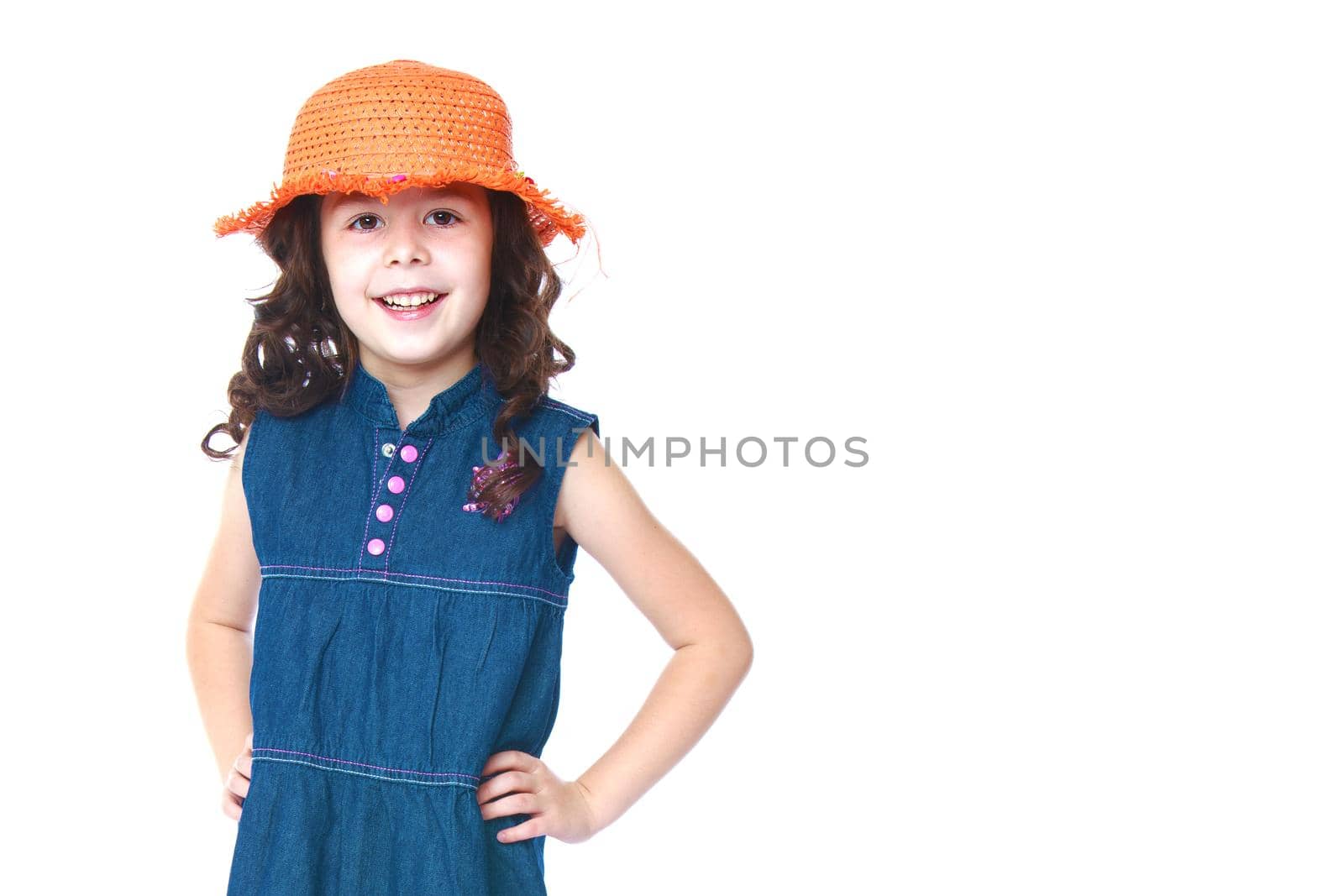 Beautiful little girl posing in the studio. Children's emotions concept. Close-up. Isolated on white background.