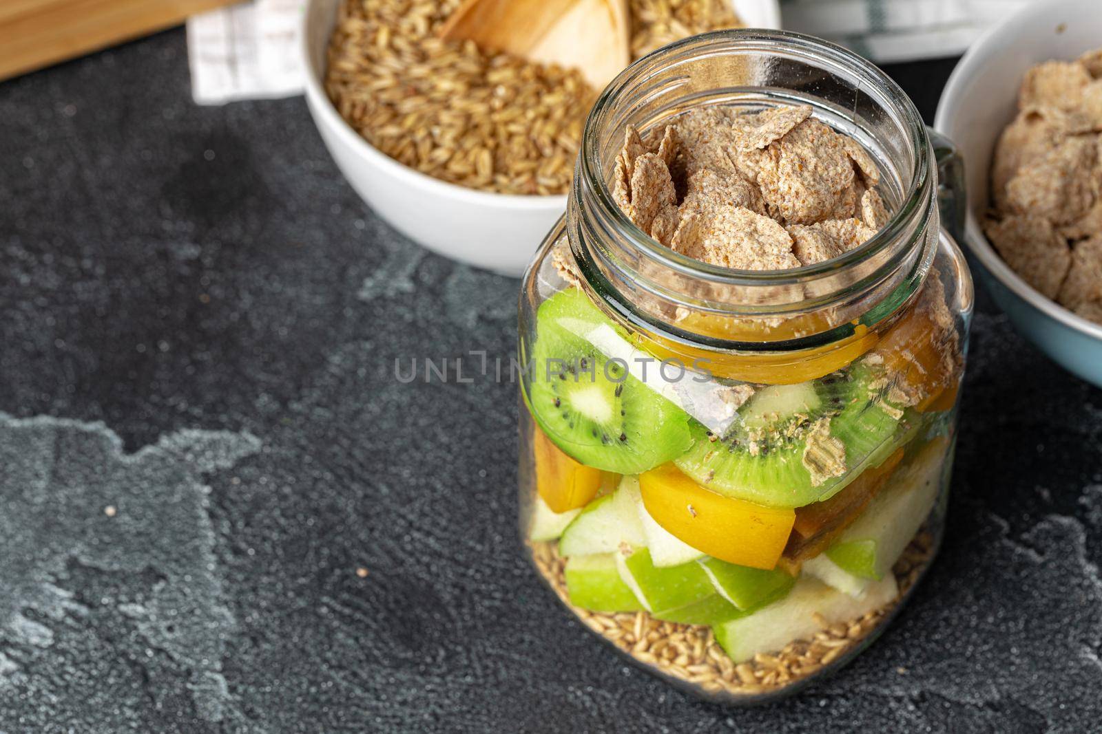 Healthy food: porridge with fruit on the table. Close up.