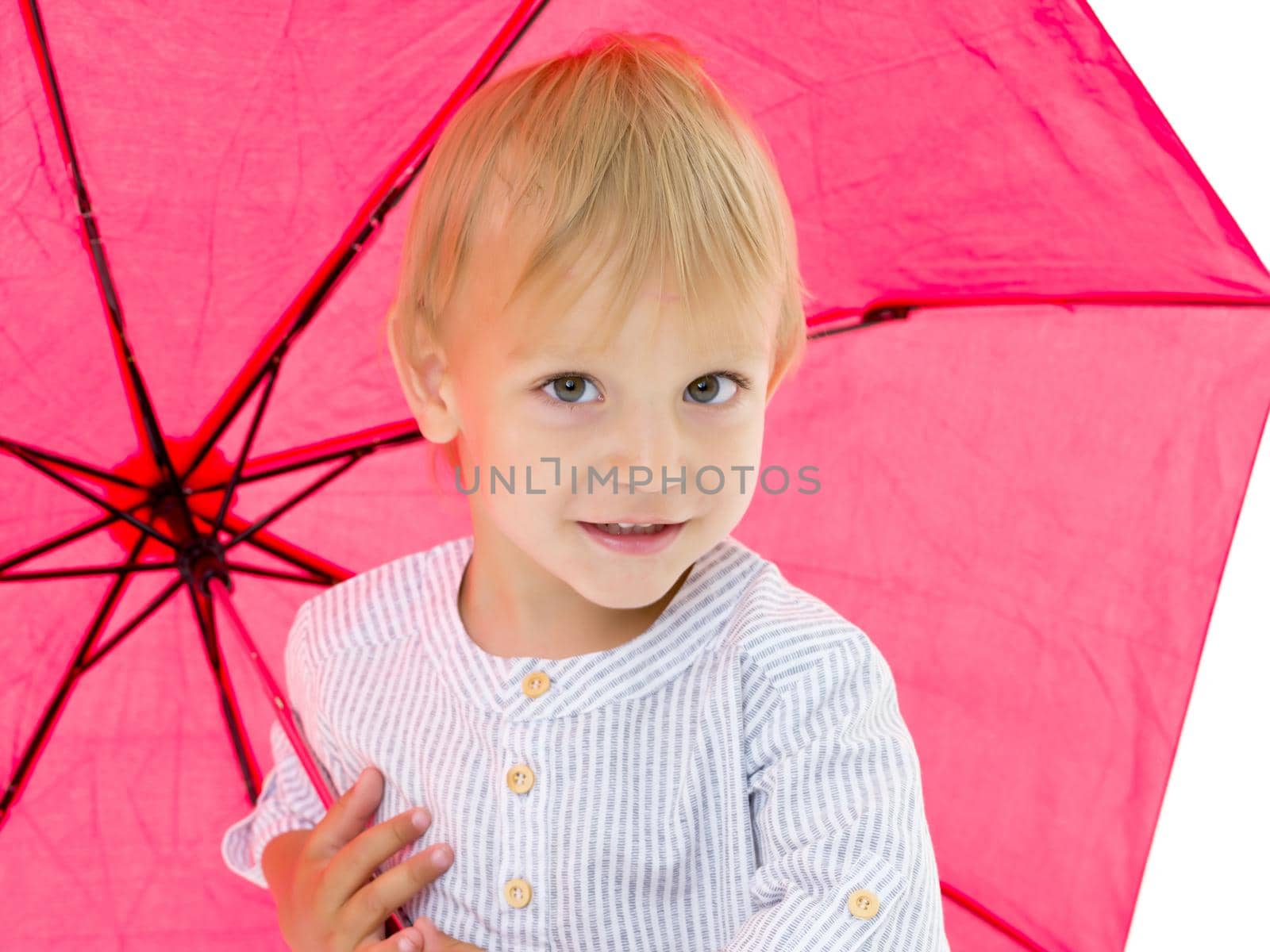 A cute little boy took refuge under an umbrella. Concept game, h by kolesnikov_studio