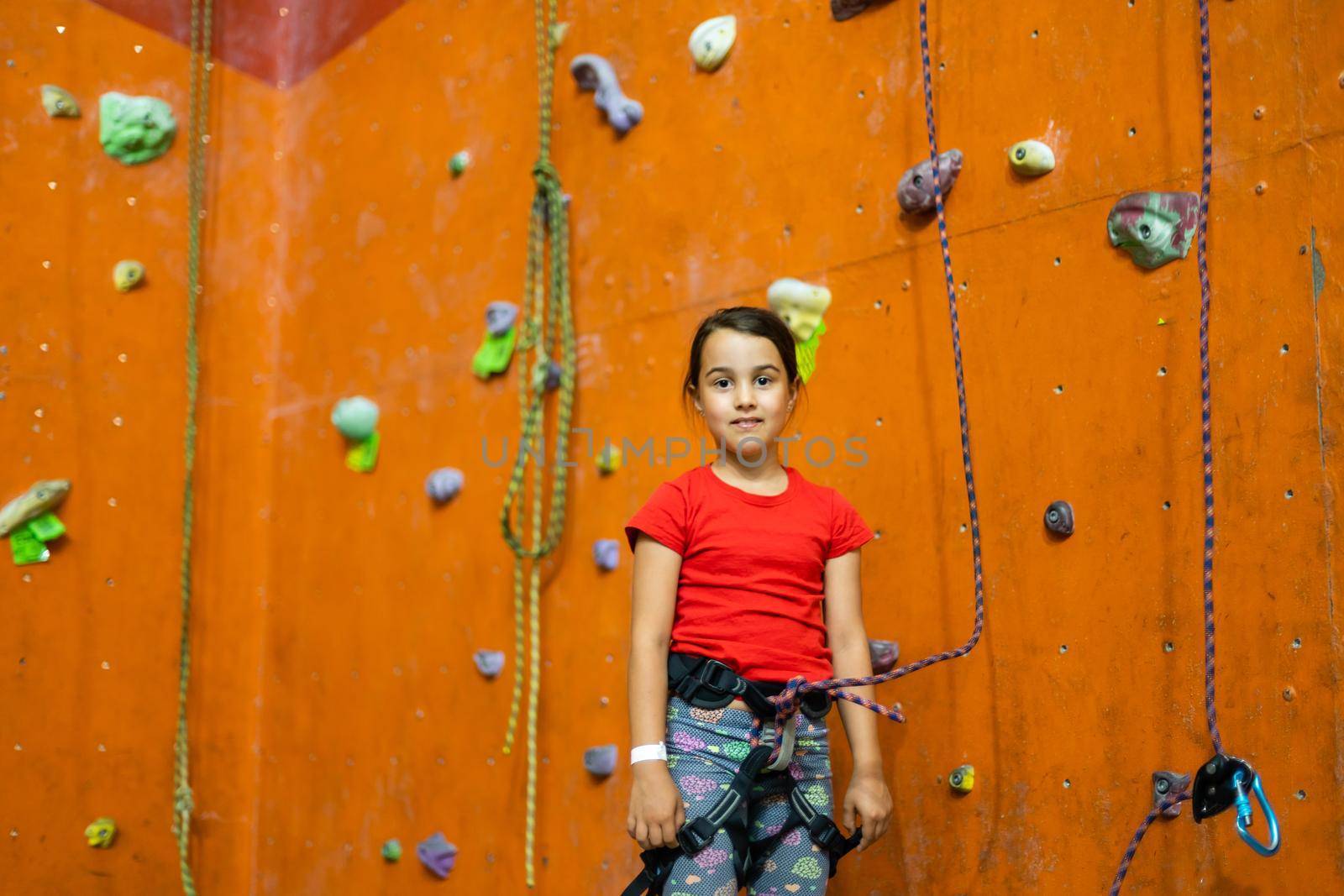 Little Girl Climbing Rock Wall