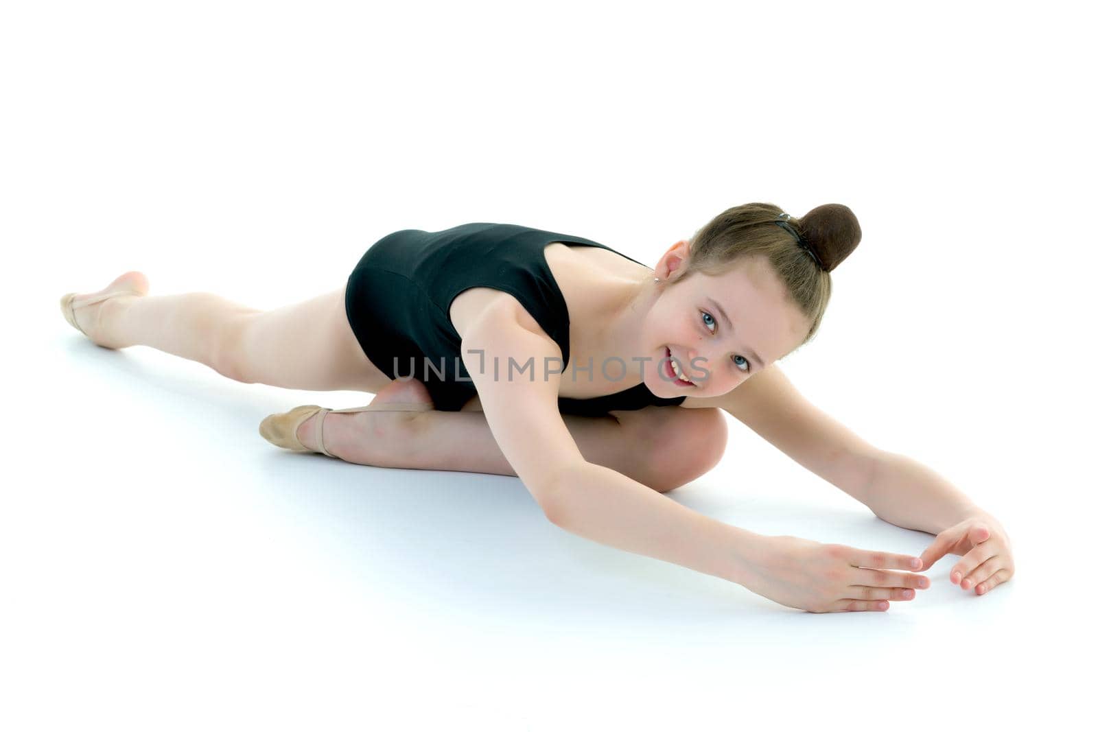 The gymnast perform an acrobatic element on the floor. by kolesnikov_studio