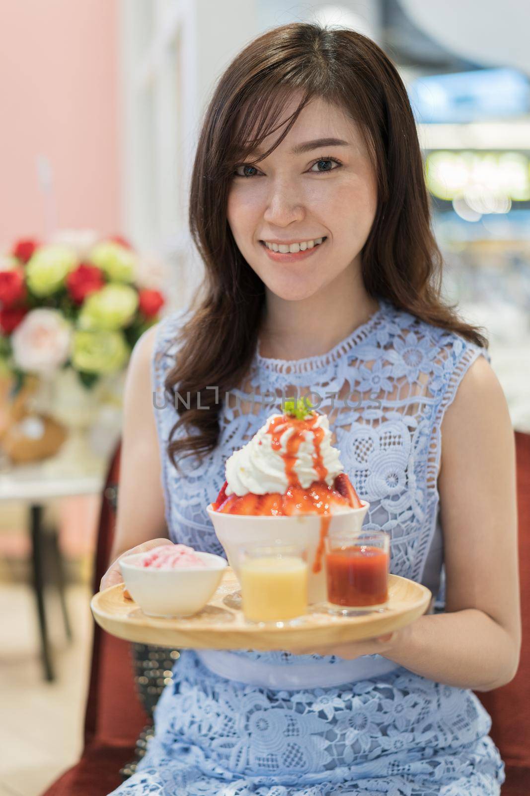 woman holding shaved ice or strawberry bingsu fresh milk  by geargodz