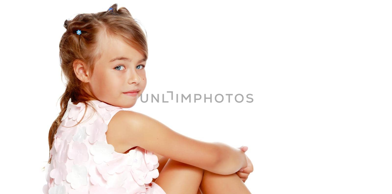 Beautiful little girl close-up. The concept of beauty and fashion, happy childhood. Isolated on white background.