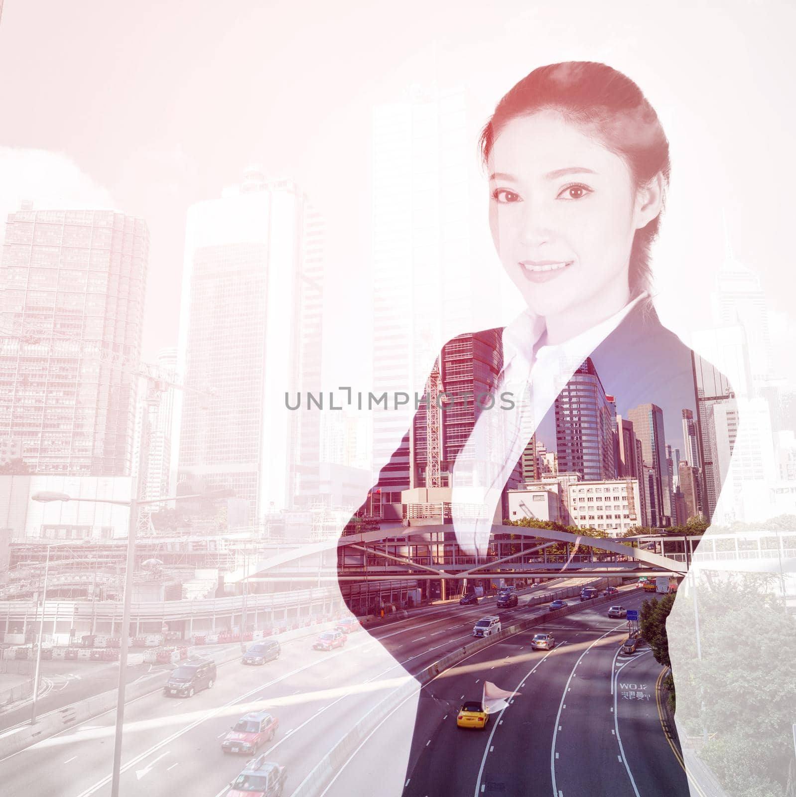 double exposure of  business woman crossed arms with Hong Kong city background