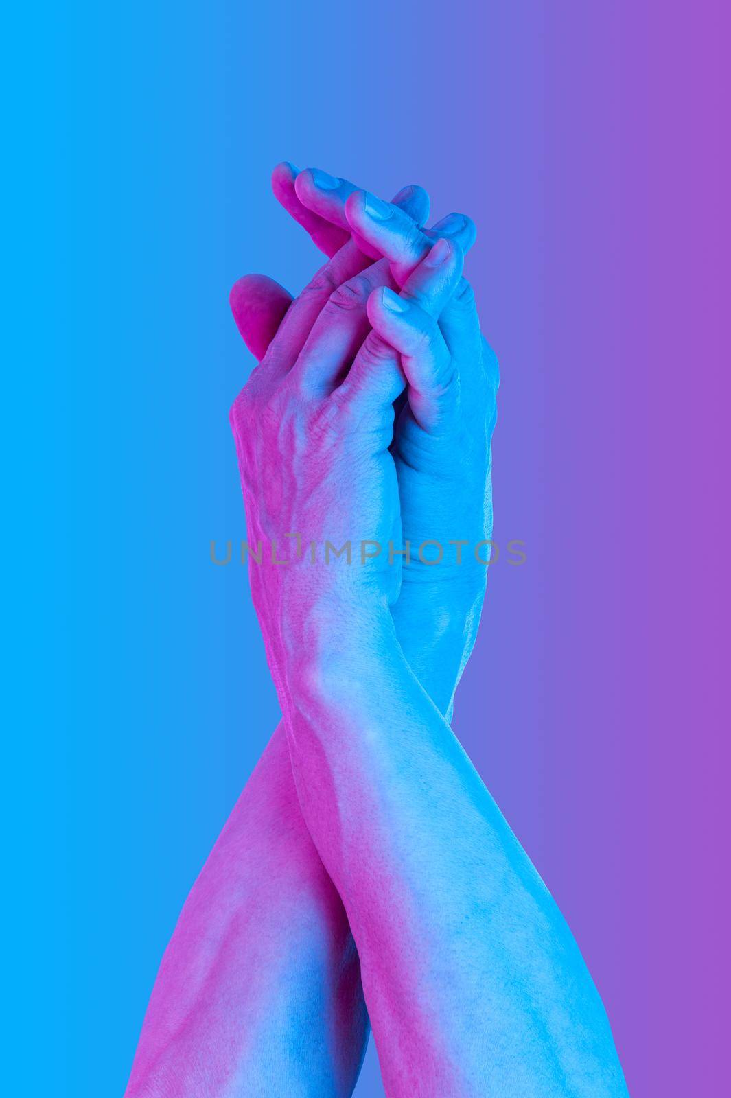 Hands in a surreal style in violet blue neon colors. Modern psychedelic creative element with human palm for posters, banners, wallpaper. Copy space for text. Pop art culture. Magazine style template.