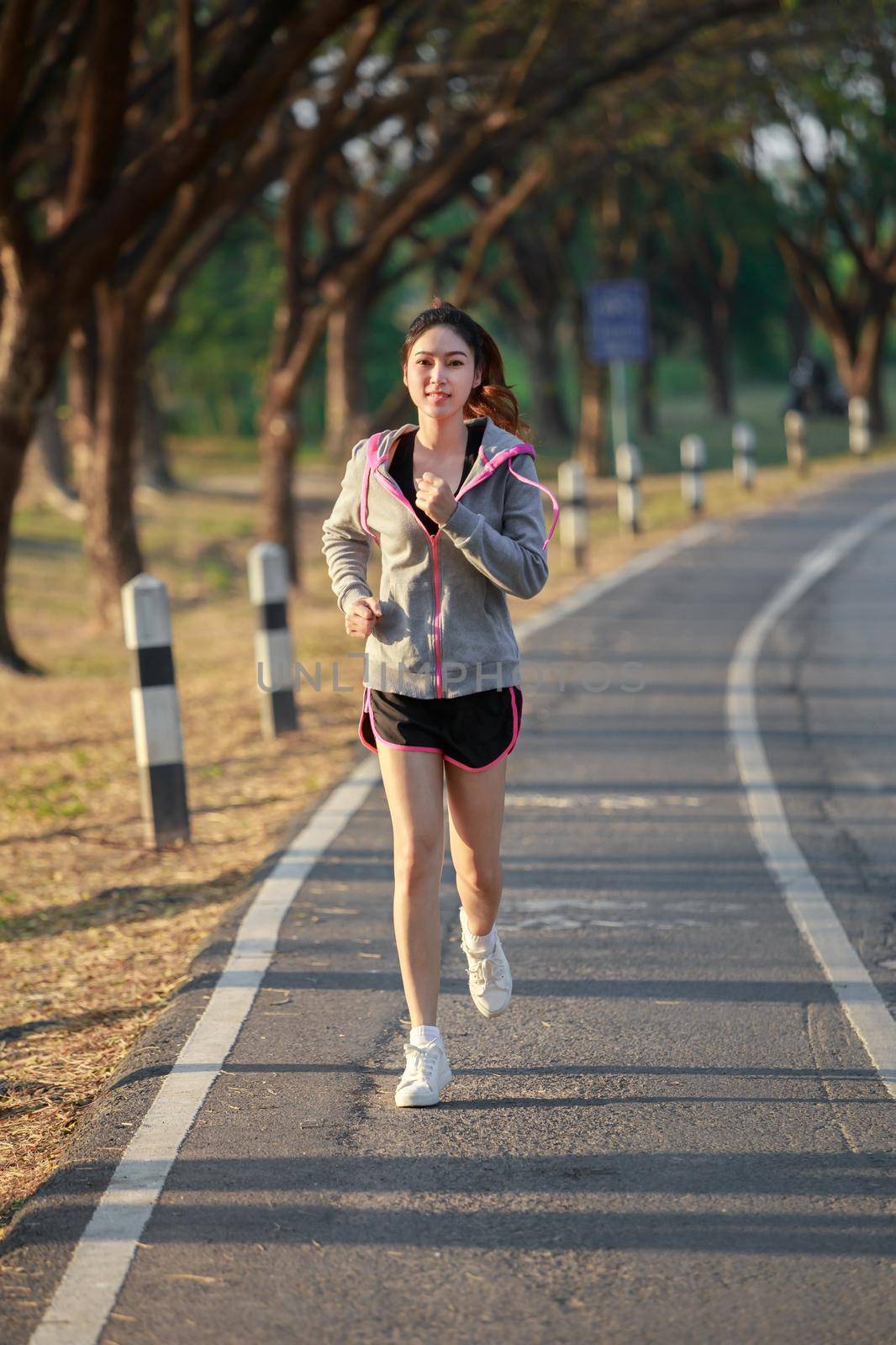 fitness woman running in park by geargodz