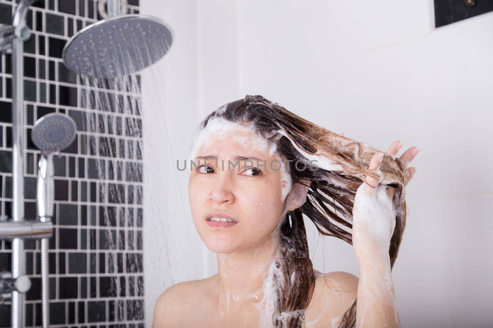 unhappy woman washing head with shampoo and shower by geargodz