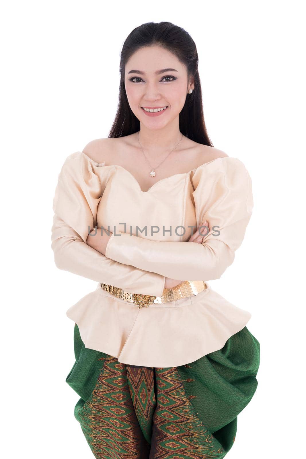 beautiful woman in Thai traditional dress with her arms crossed isolated on white background