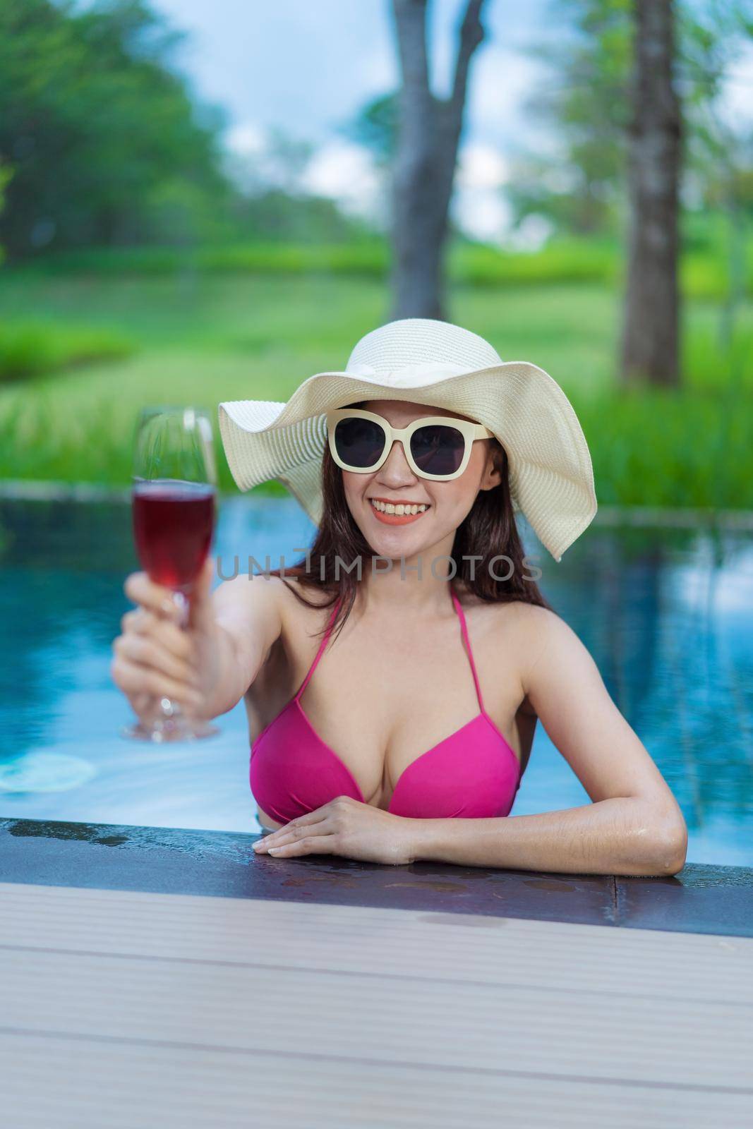 happy beautiful woman in the swimming pool 