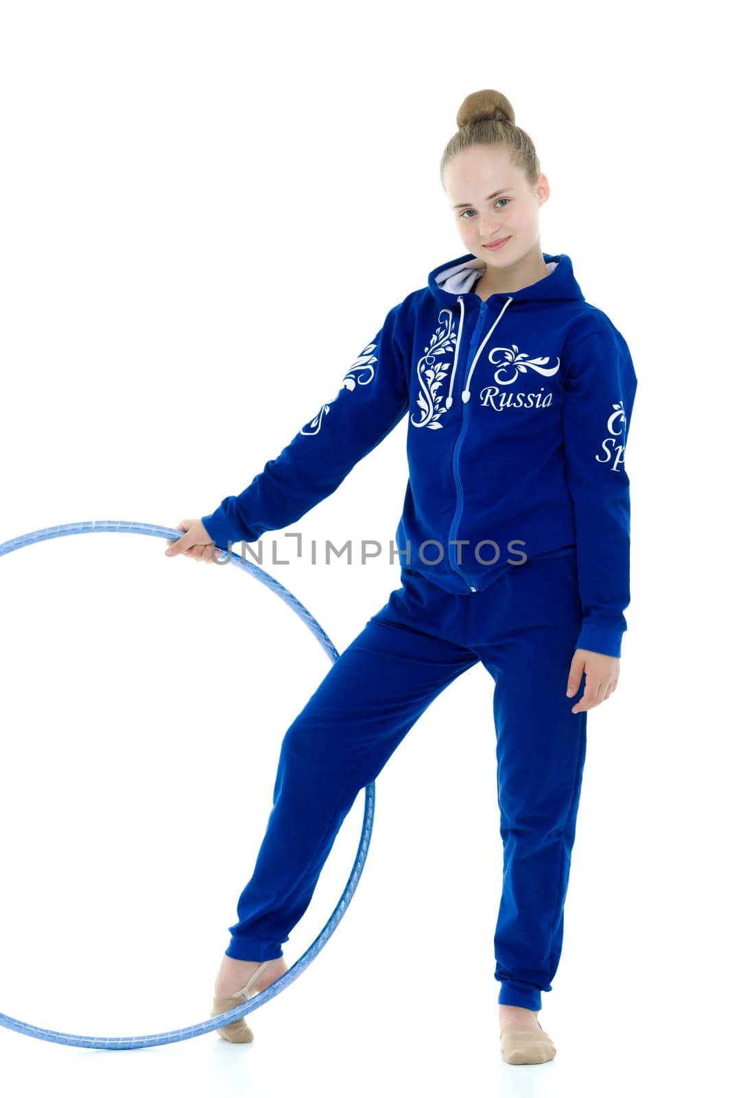 A girl gymnast performs an exercise with a hoop. The concept of gymnastics and fitness. Isolated on white background.