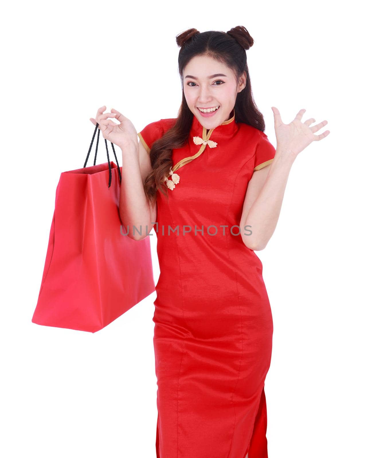 woman holding shopping bag on chinese new year celebration isolated on a white background by geargodz