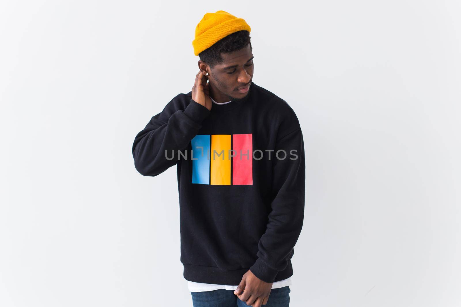 Youth fashion concept - Portrait of confident sexy black woman in stylish hoodie on white.