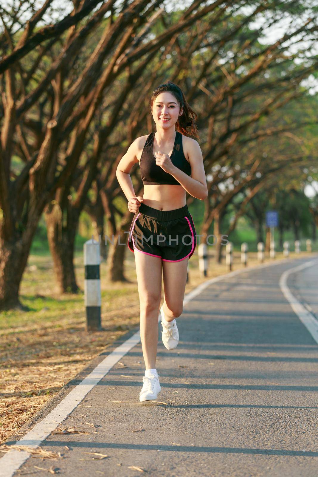 fitness woman running in park by geargodz