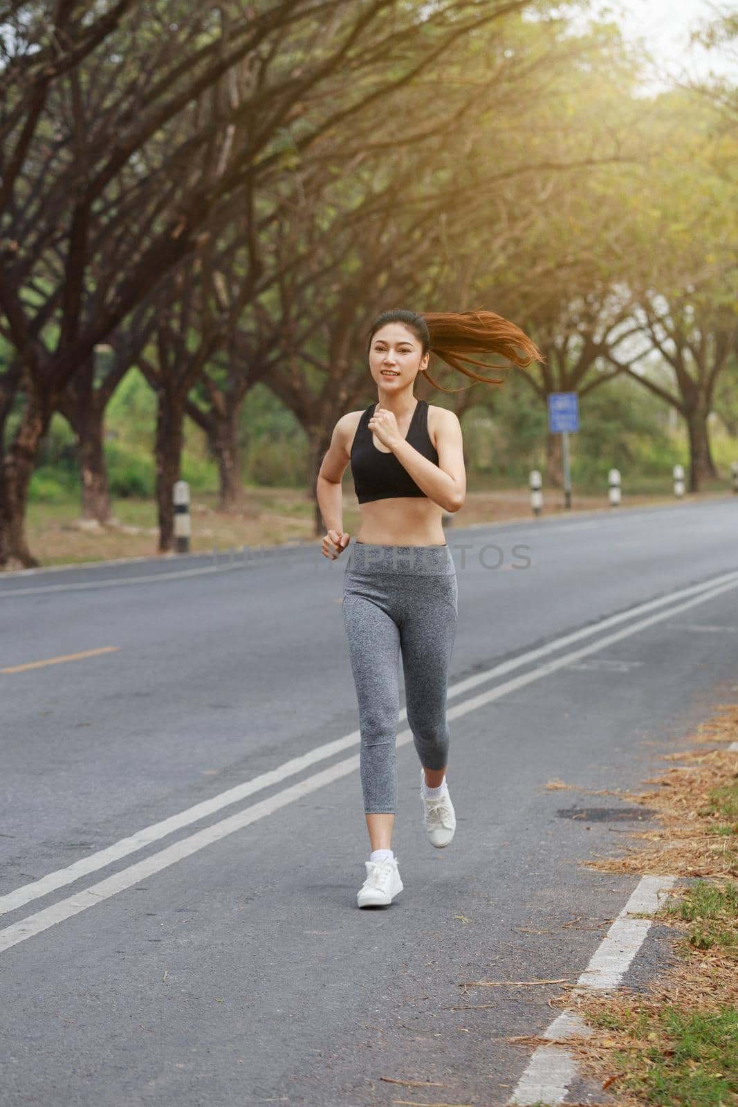 fitness woman running in the park by geargodz