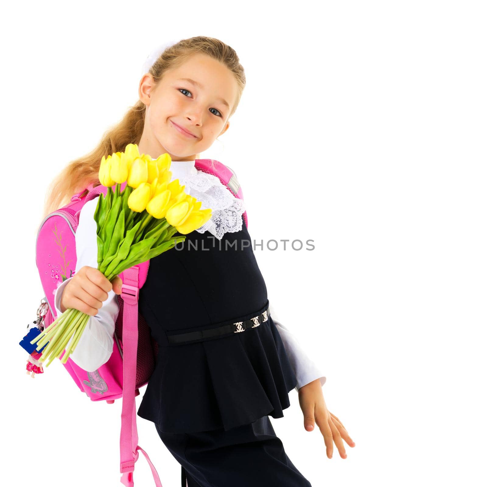 Little girl goes to school with a bouquet of flowers. The concept of a happy childhood, school education. Isolated on white background.