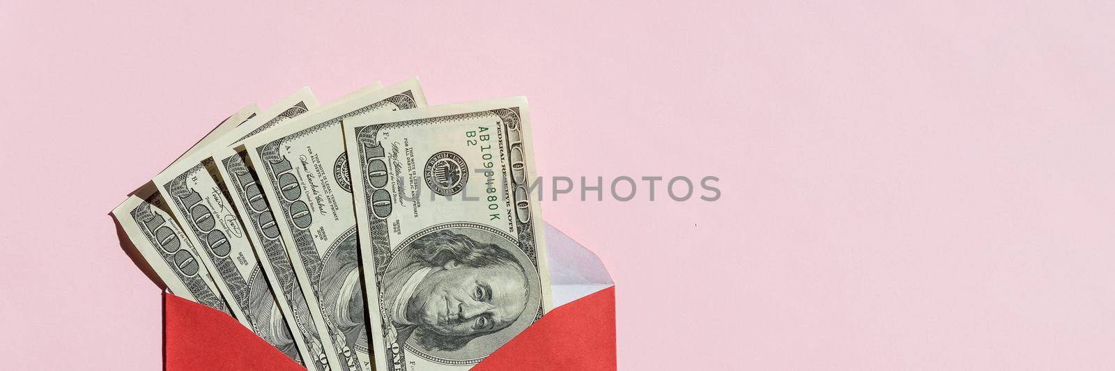 US dollars in an envelope isolated on white background