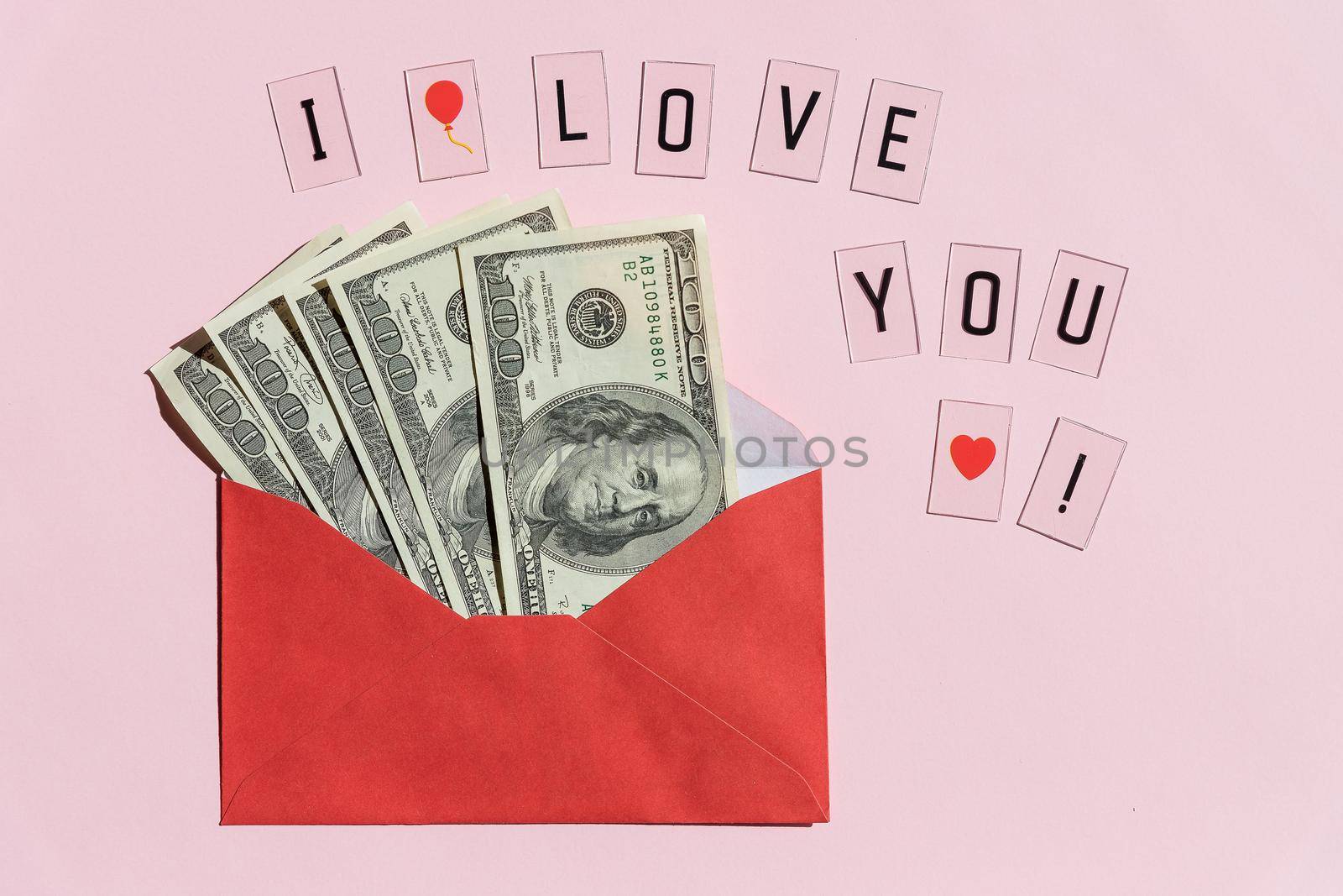 open a paper envelope with the hundred dollar bils. isolated on white