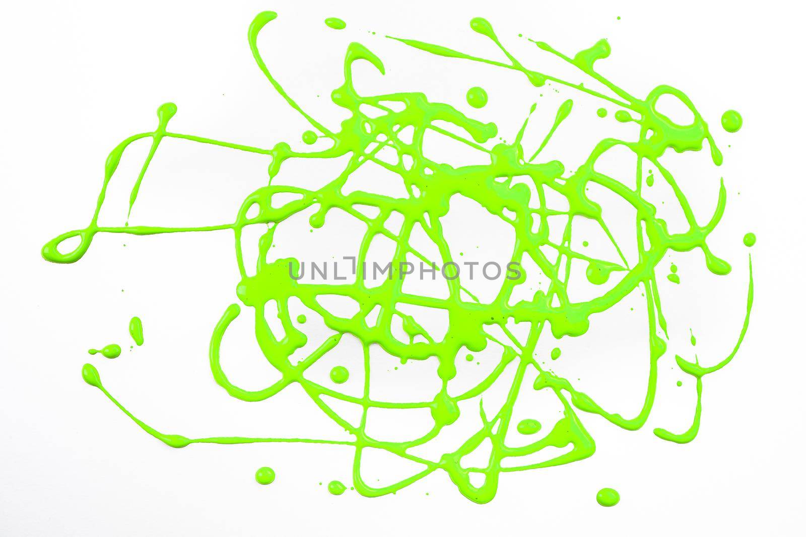 Abstract art and craft with green tempera, made by dripping paint from height