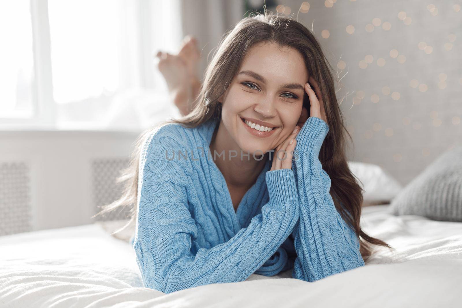 Portrait of a young happy woman at home. High quality photo