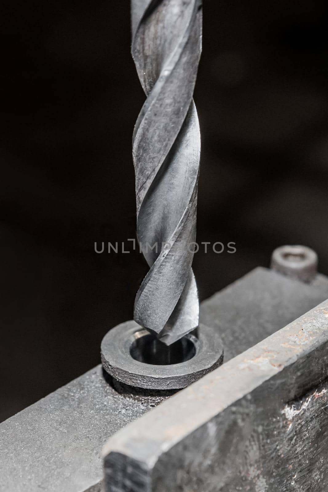 Drill close-up for metal and iron drilling industrial work tool.