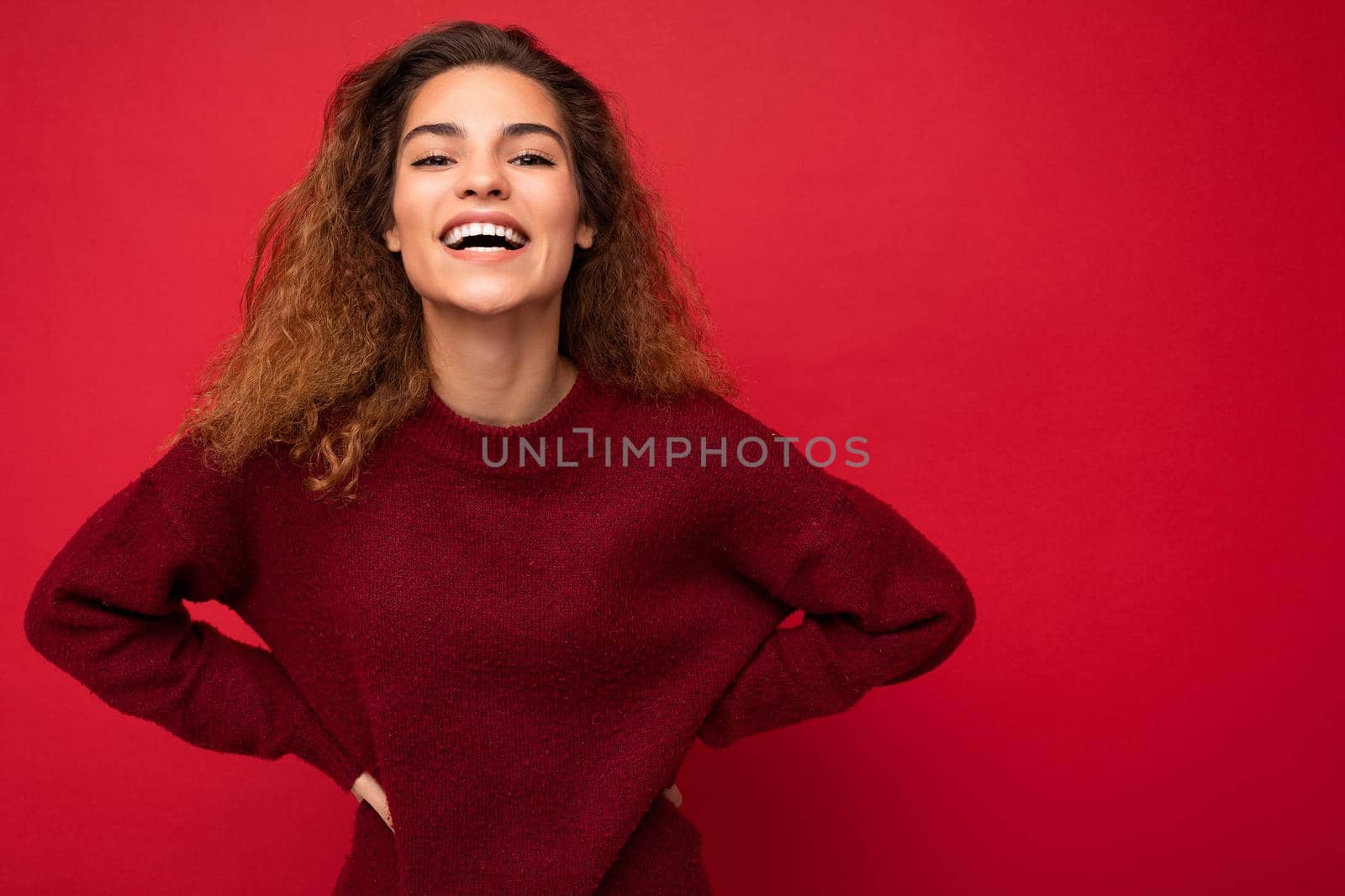 Photo shot of pretty joyful smiling young female person wearing casual trendy outfit standing isolated on colourful background with copy space looking at camera and having fun by TRMK