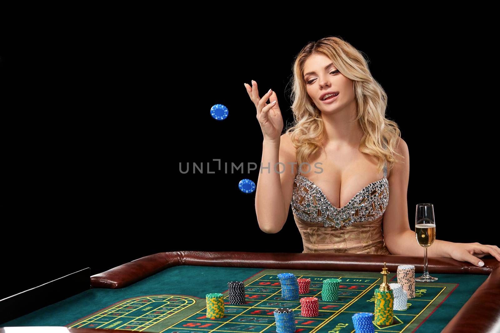 woman in a smart dress plays roulette. addiction to gambling. bets, throwing chips