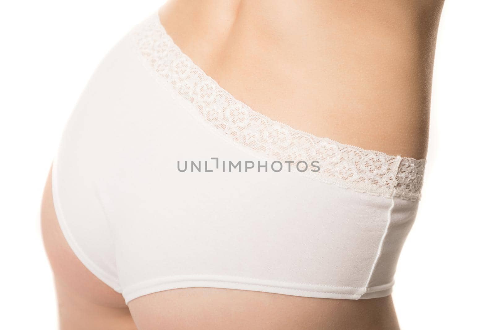 girl in panties, half-length shot on white background.