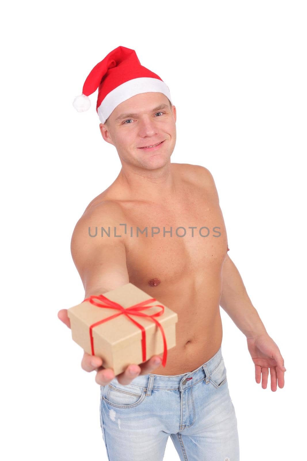 handsome young guy wearing Santa Claus cap, isolated on white