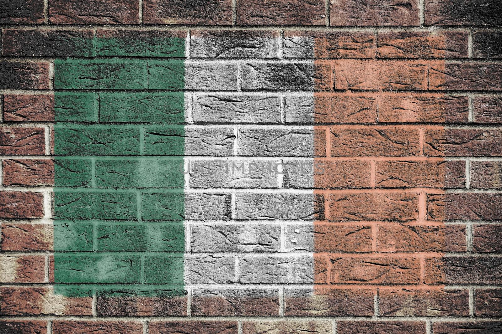 An Ireland flag painted on brick wall background